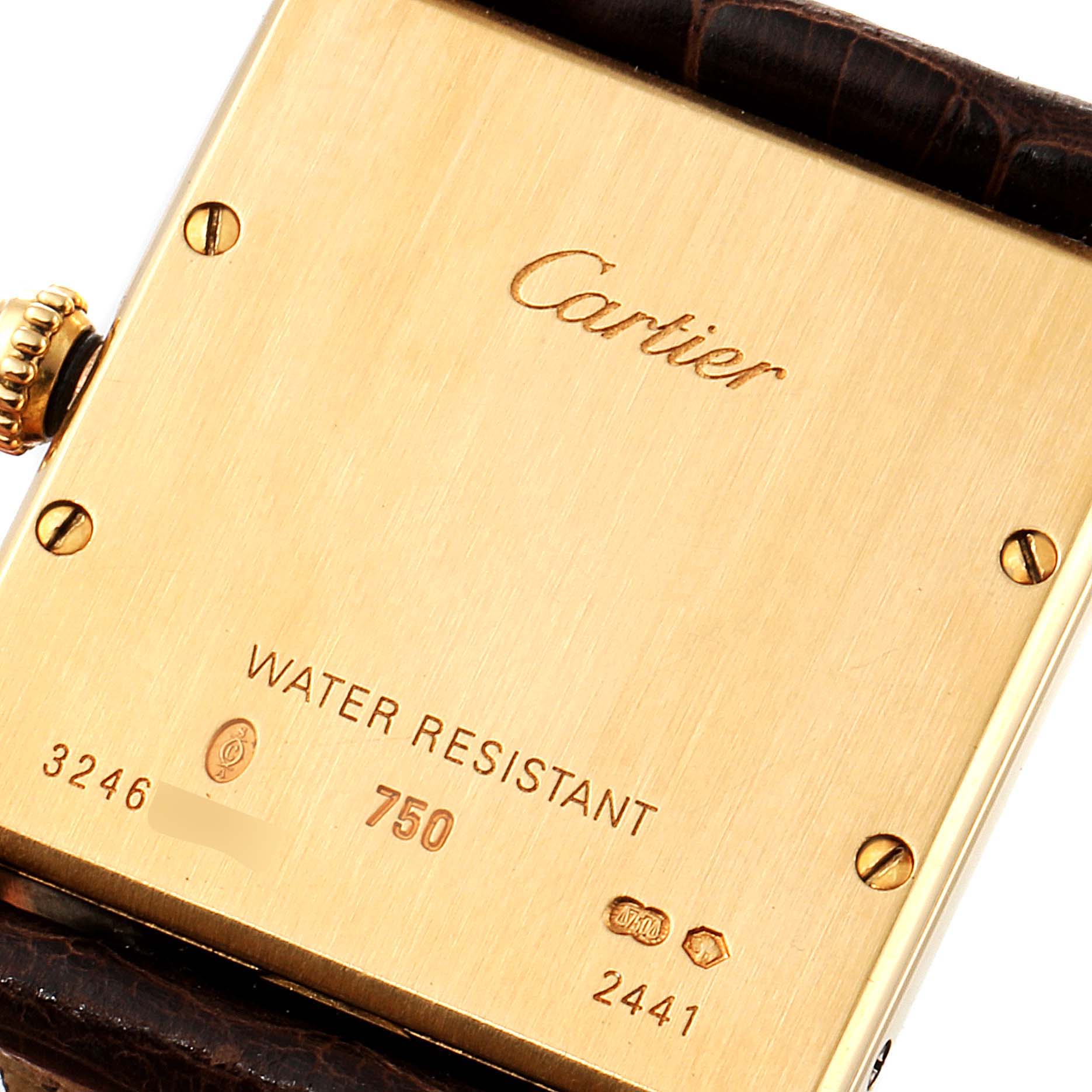 This image shows the back case of the Cartier Tank Louis W1529756 Men
s Yellow Gold Silver Dial W1529756 Men
s Yellow Gold Silver Dial model watch, displaying inscriptions and screws.