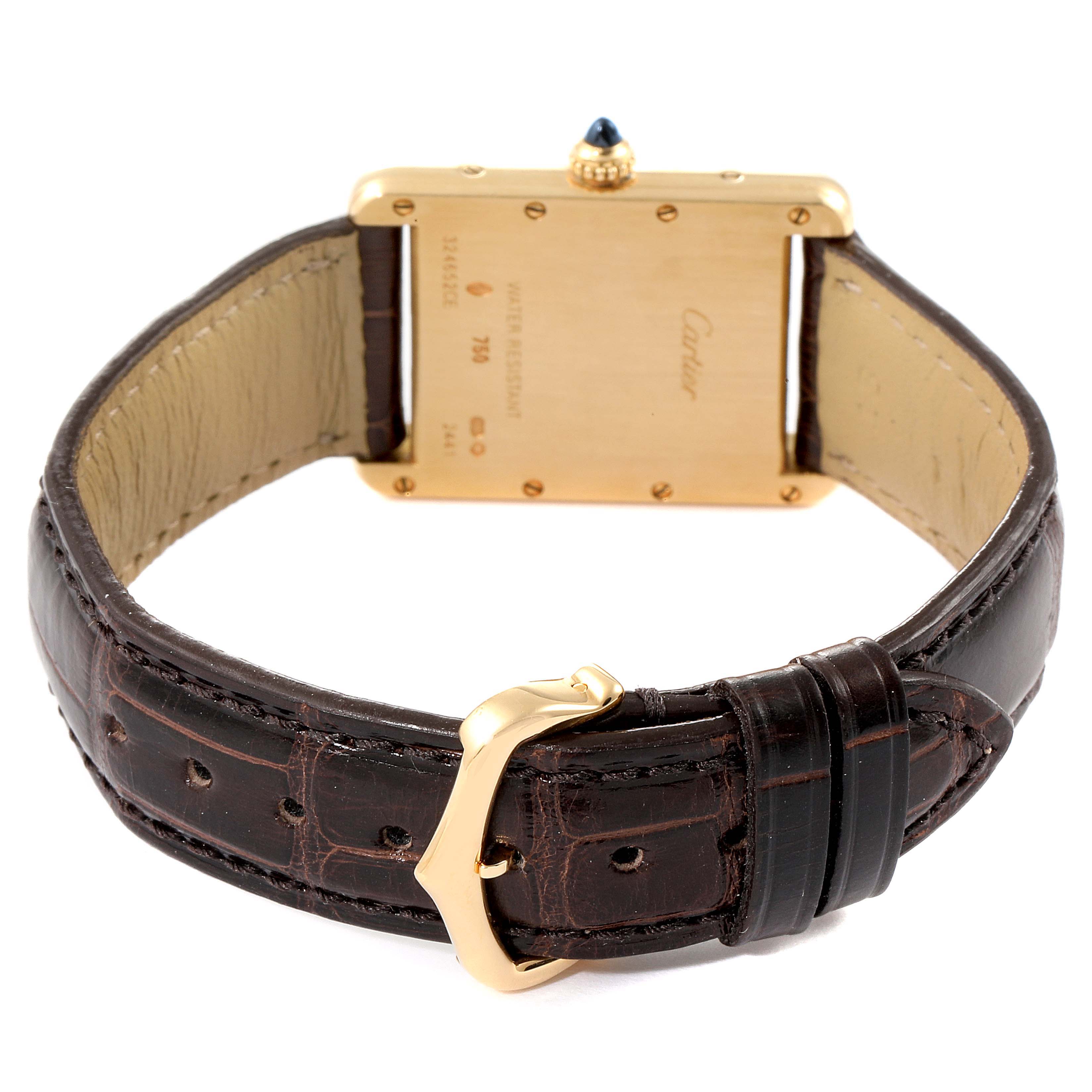 This image shows the back view of a Cartier Tank Louis W1529756 Men
s Yellow Gold Silver Dial W1529756 Men
s Yellow Gold Silver Dial watch, including its case back, crown, and dark leather strap with buckle.