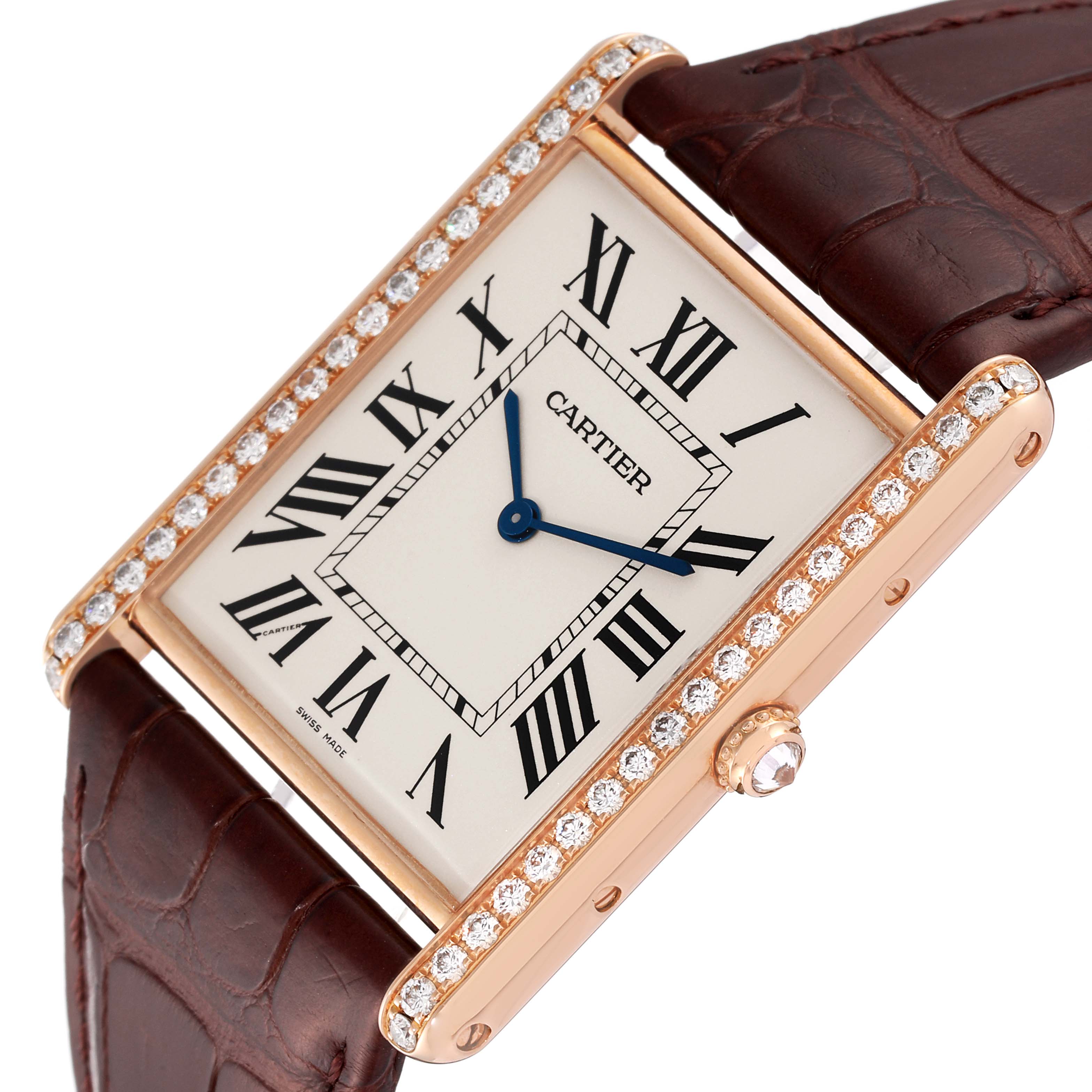 This image shows a close-up of the Tank Louis model by Cartier, highlighting its dial, diamond-studded bezel, and strap.