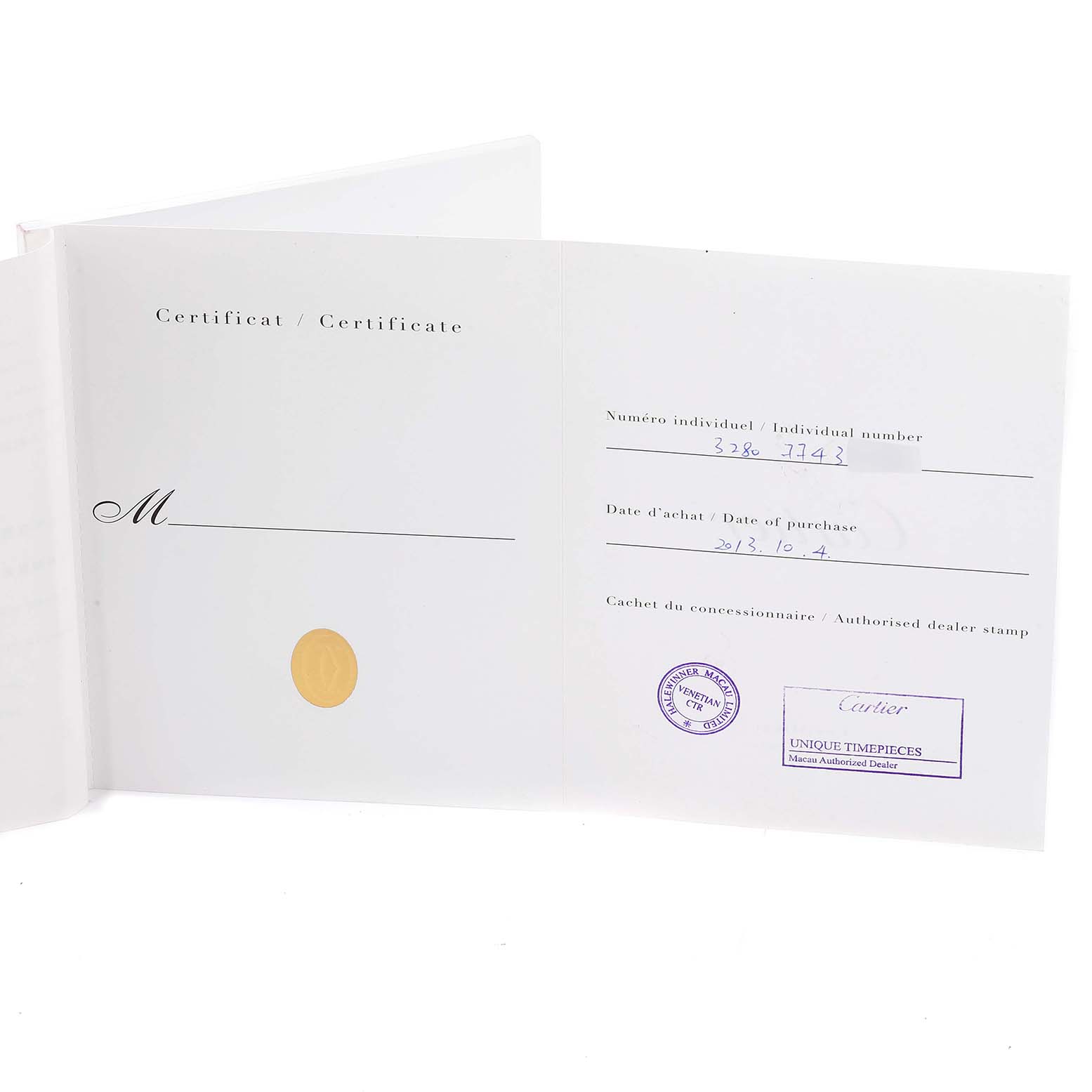 The image shows the opened certificate and warranty booklet for a Tank Louis model by Cartier.