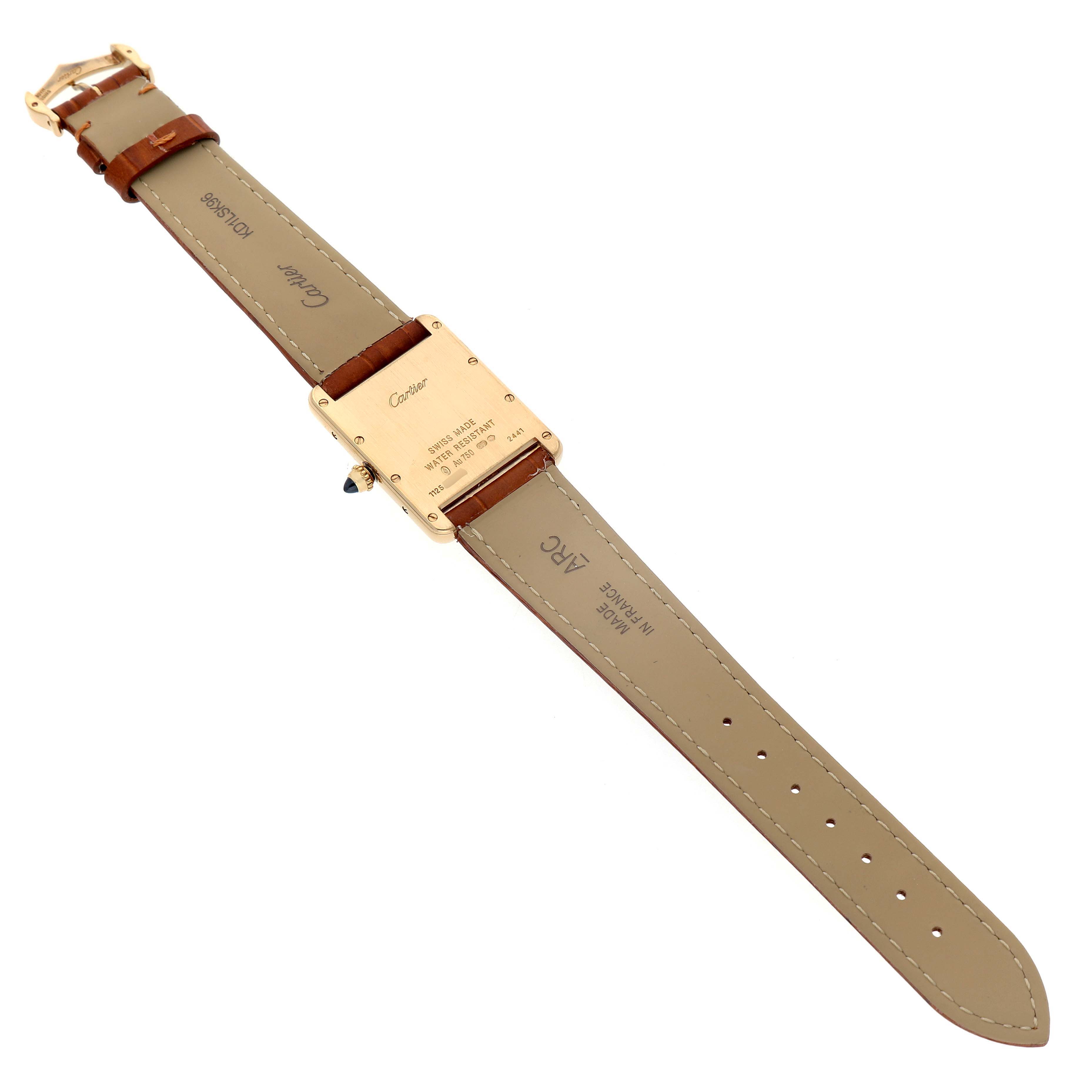 The image shows the back of the Cartier Tank Louis W1529756 Men's Yellow Gold Silver Dial watch, highlighting the leather strap and clasp.