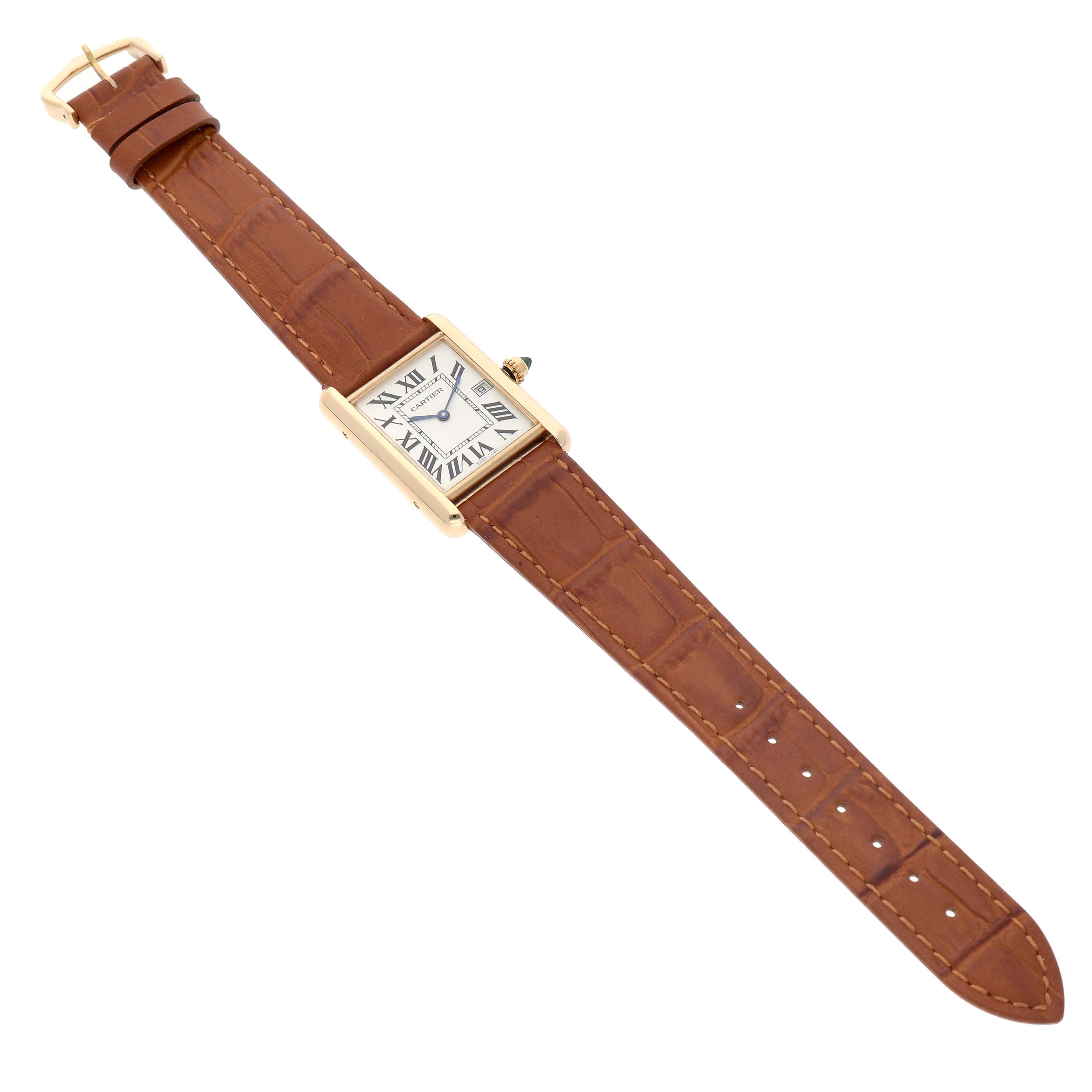 The Cartier Tank Louis W1529756 Men's Yellow Gold Silver Dial watch is shown from an angled top view, displaying the case, dial, and brown leather strap.