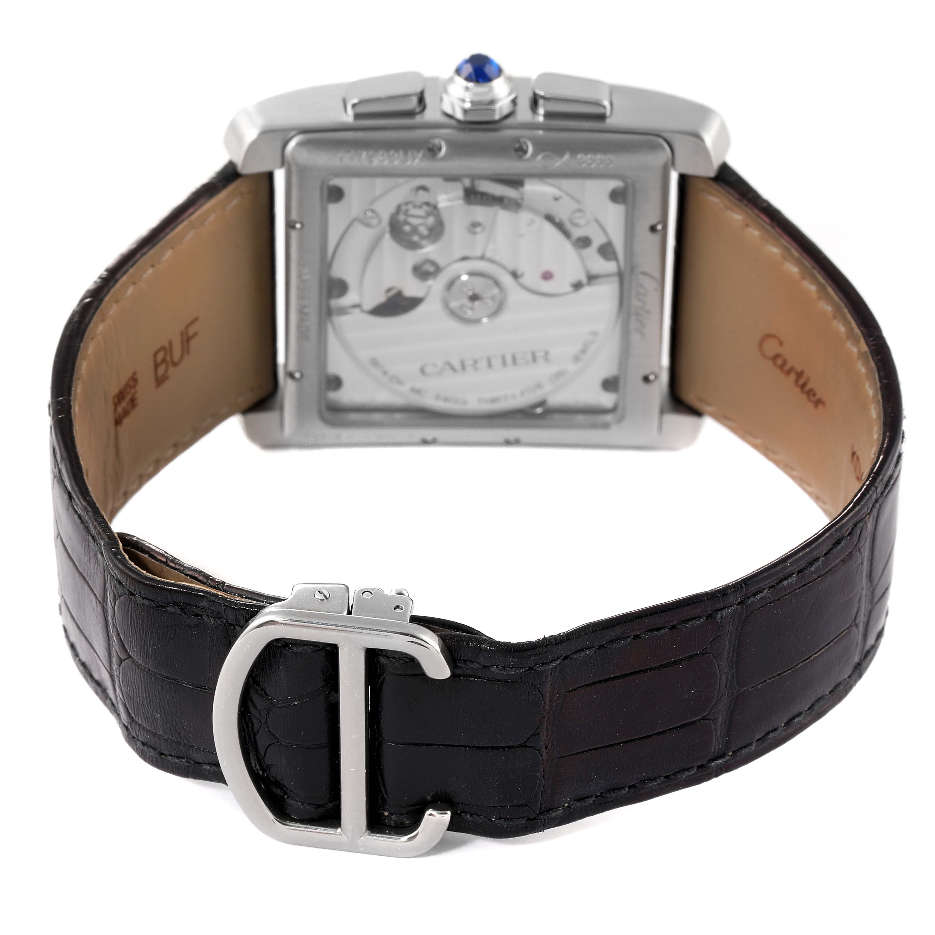 The image shows the back view of a Cartier Tank MC W5330007 Men's Stainless Steel Silver Dial W5330007 Men's Stainless Steel Silver Dial watch, highlighting its movement and leather strap with a deployment clasp.