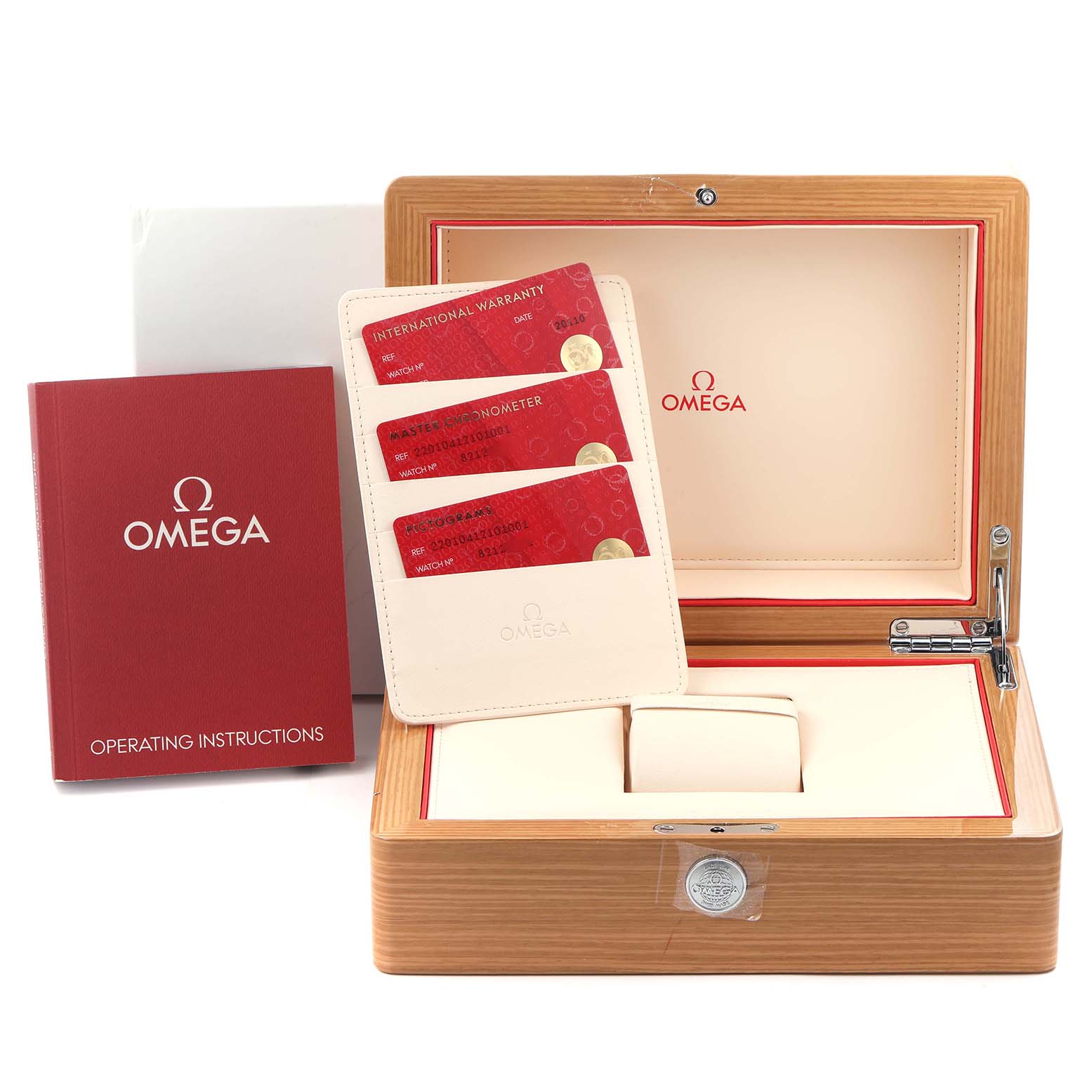 The image shows the Omega Aqua Terra 220.10.41.21.01.001 watch box, warranty cards, and operating instructions, with the box slightly open.