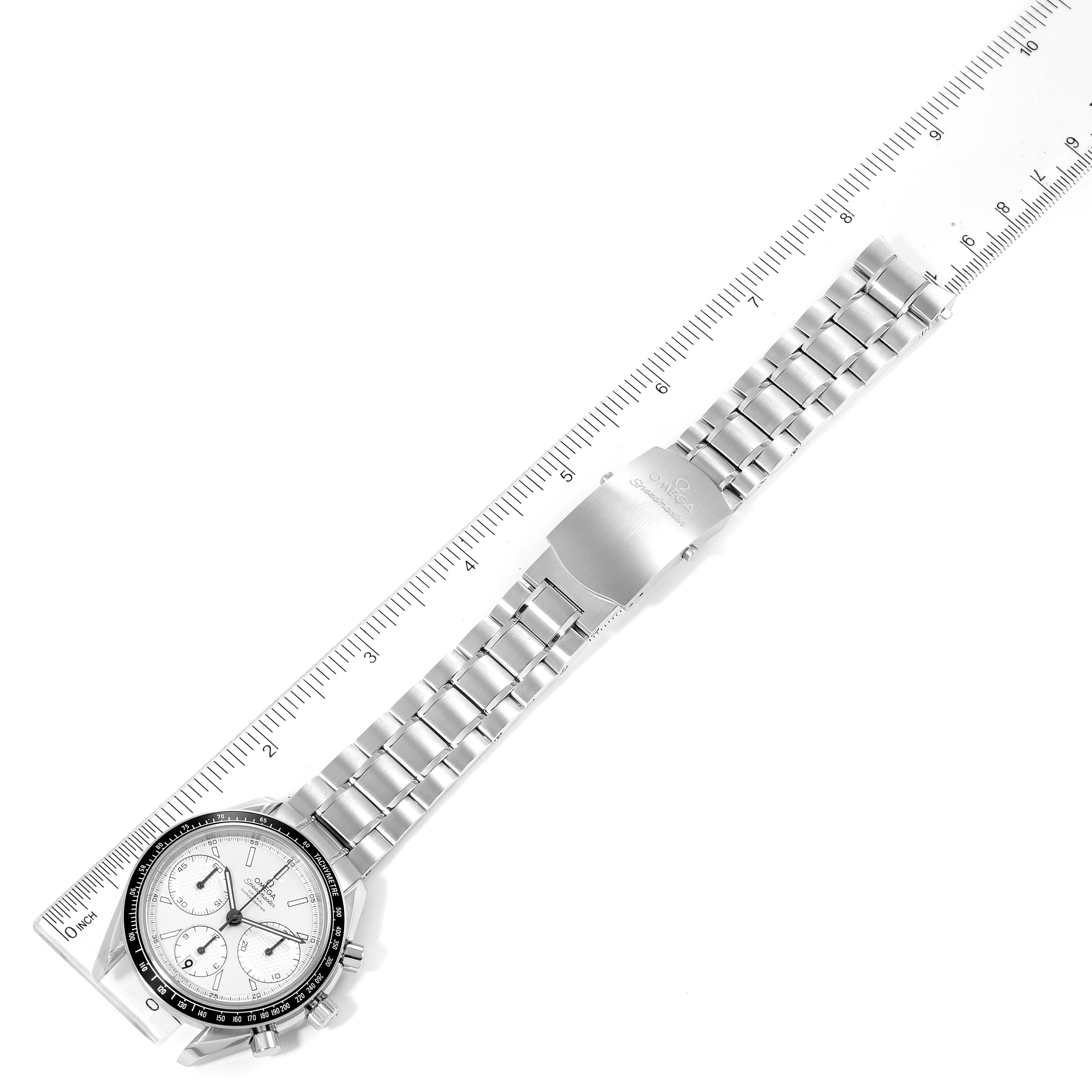 The Omega Speedmaster 326.30.40.50.02.001 Men
s Stainless Steel Silver Dial 326.30.40.50.02.001 Men
s Stainless Steel Silver Dial watch is shown from above, with the full wristband extended and aligned with a ruler for measurement.