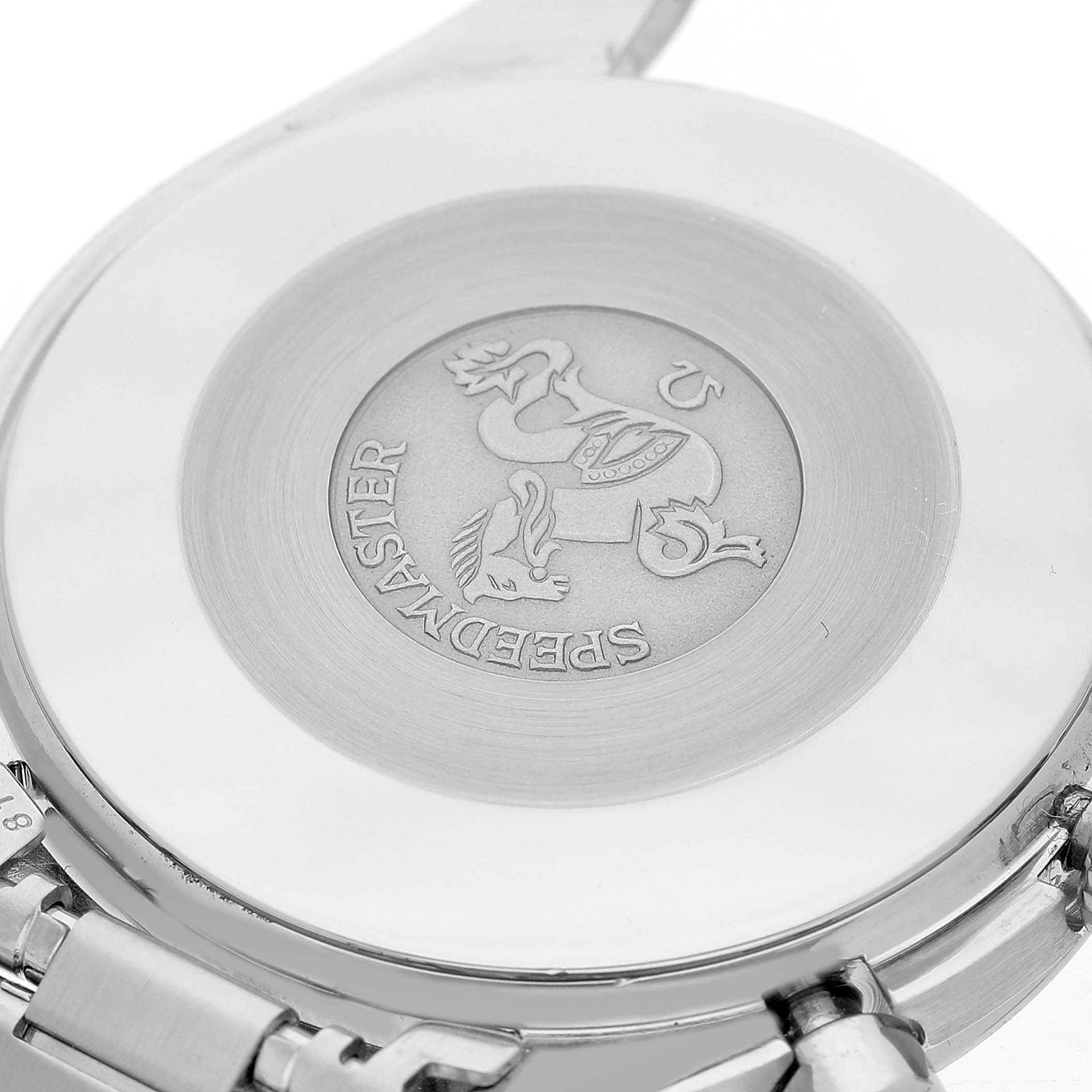 The image shows the case back of the Omega Speedmaster 3510.20.00 Men's Stainless Steel White Dial, highlighting the engraved logo and bracelet attachment.