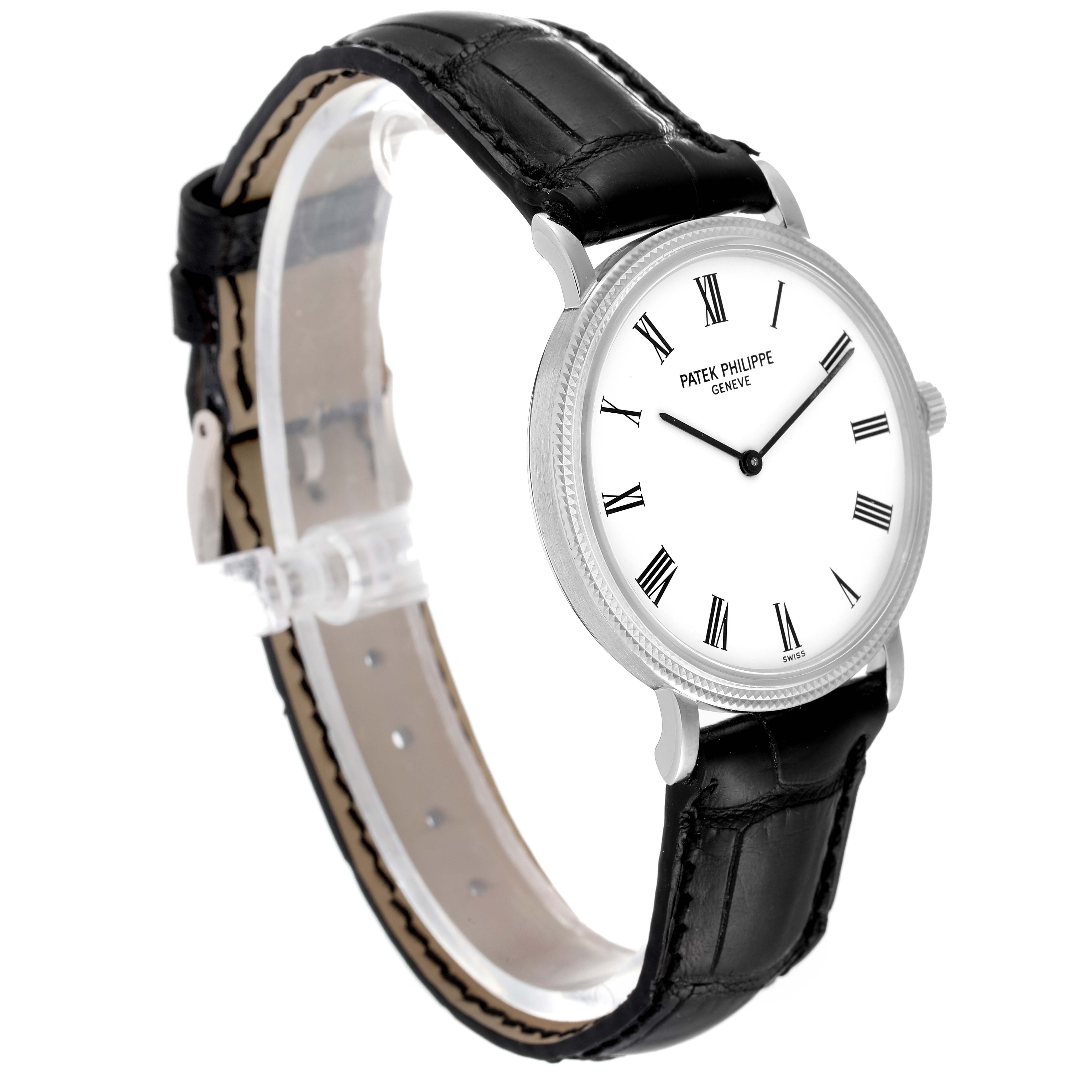 The Calatrava model by Patek Philippe is shown at an angled side view, highlighting its dial, bezel, and leather strap.