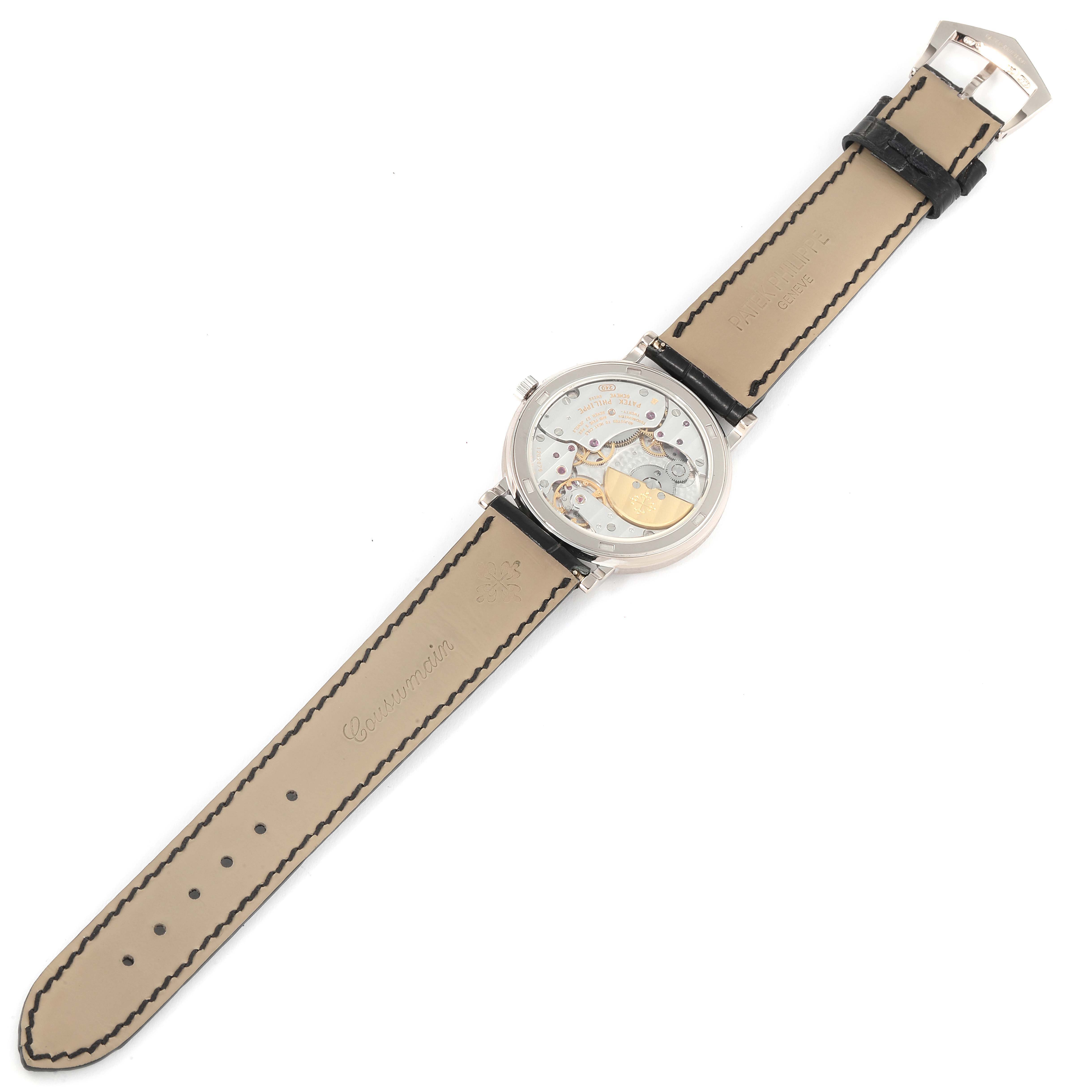 This image shows the back view of the Patek Philippe Calatrava 5120G Men's White Gold White Dial 5120G Men's White Gold White Dial model, revealing its movement and leather bands.