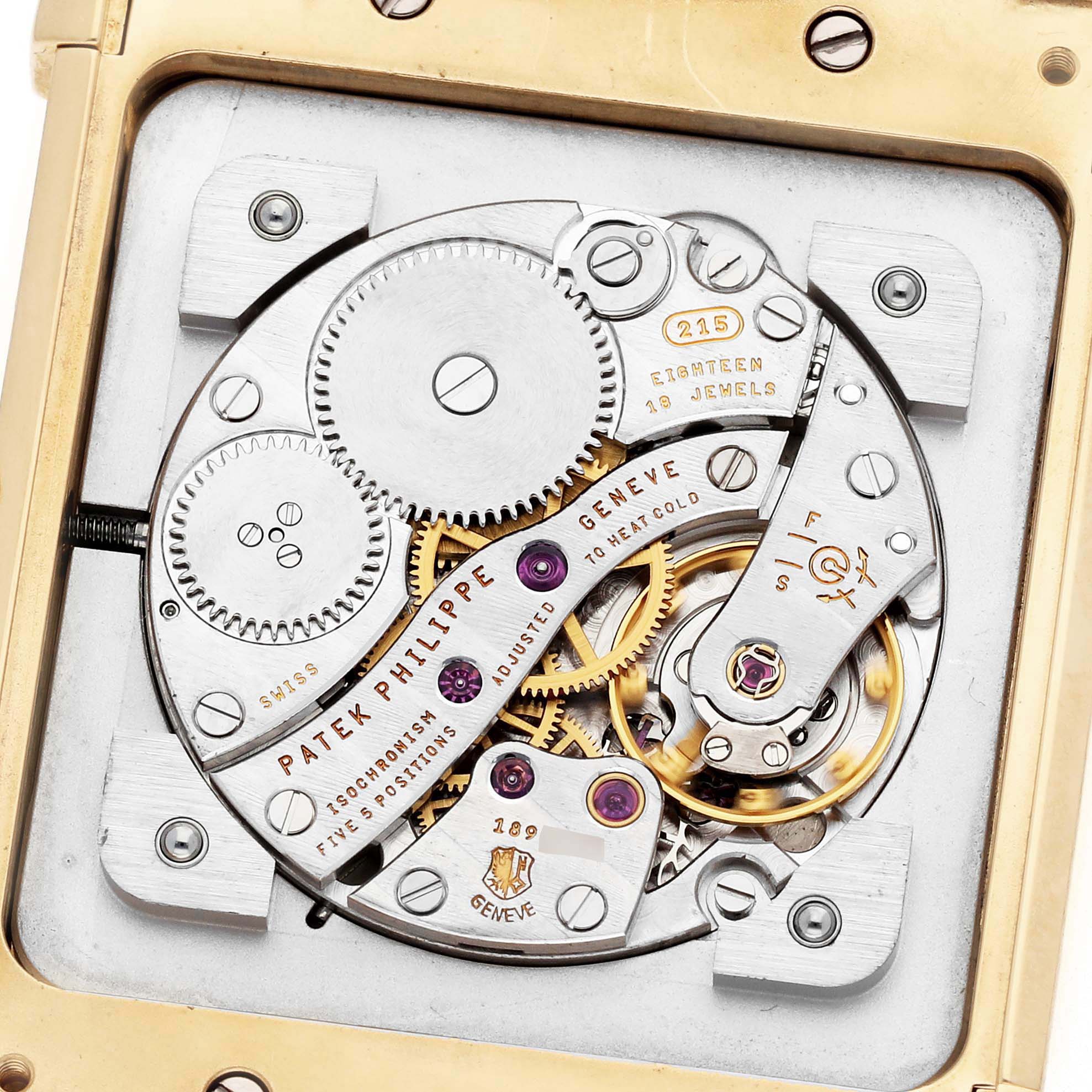 The image shows the movement of a Patek Philippe Gondolo 5111J Men's watch, displaying gears, screws, and jewels from a top-down angle.