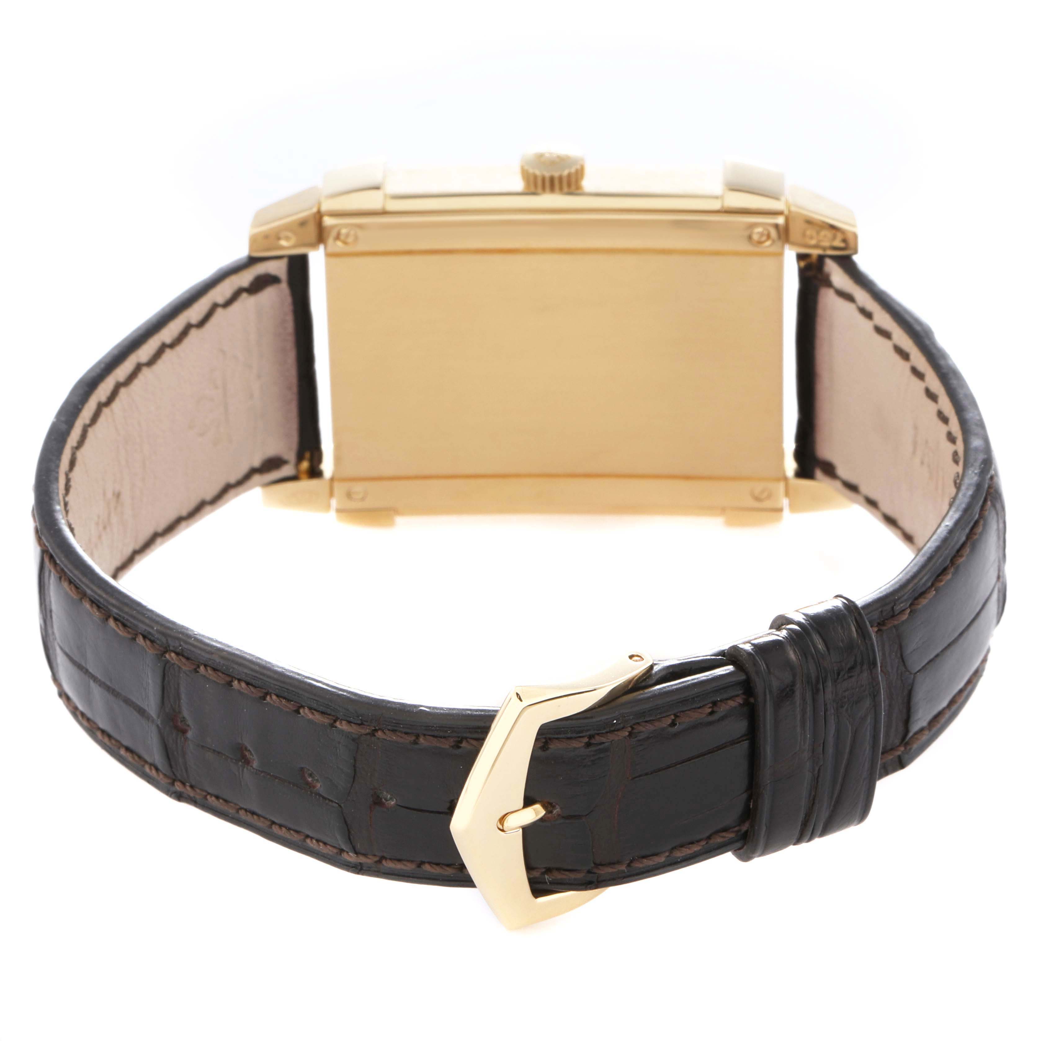The Patek Philippe Gondolo 5111J watch is shown from the back, highlighting the rectangular case, leather strap, and the buckle.
