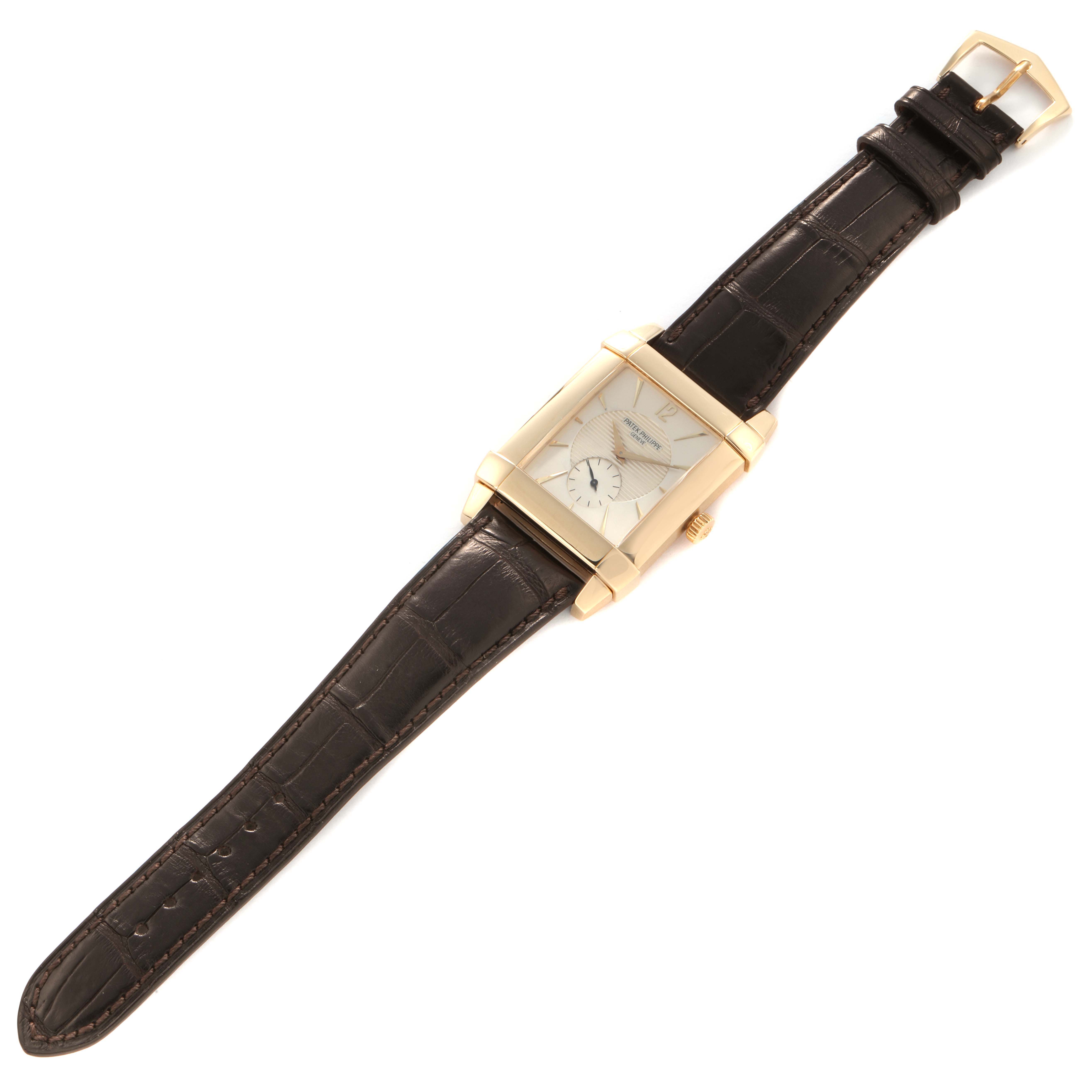 The image shows a Patek Philippe Gondolo model 5111J men's watch at an angled view, displaying the face, strap, clasp, and watch crown.