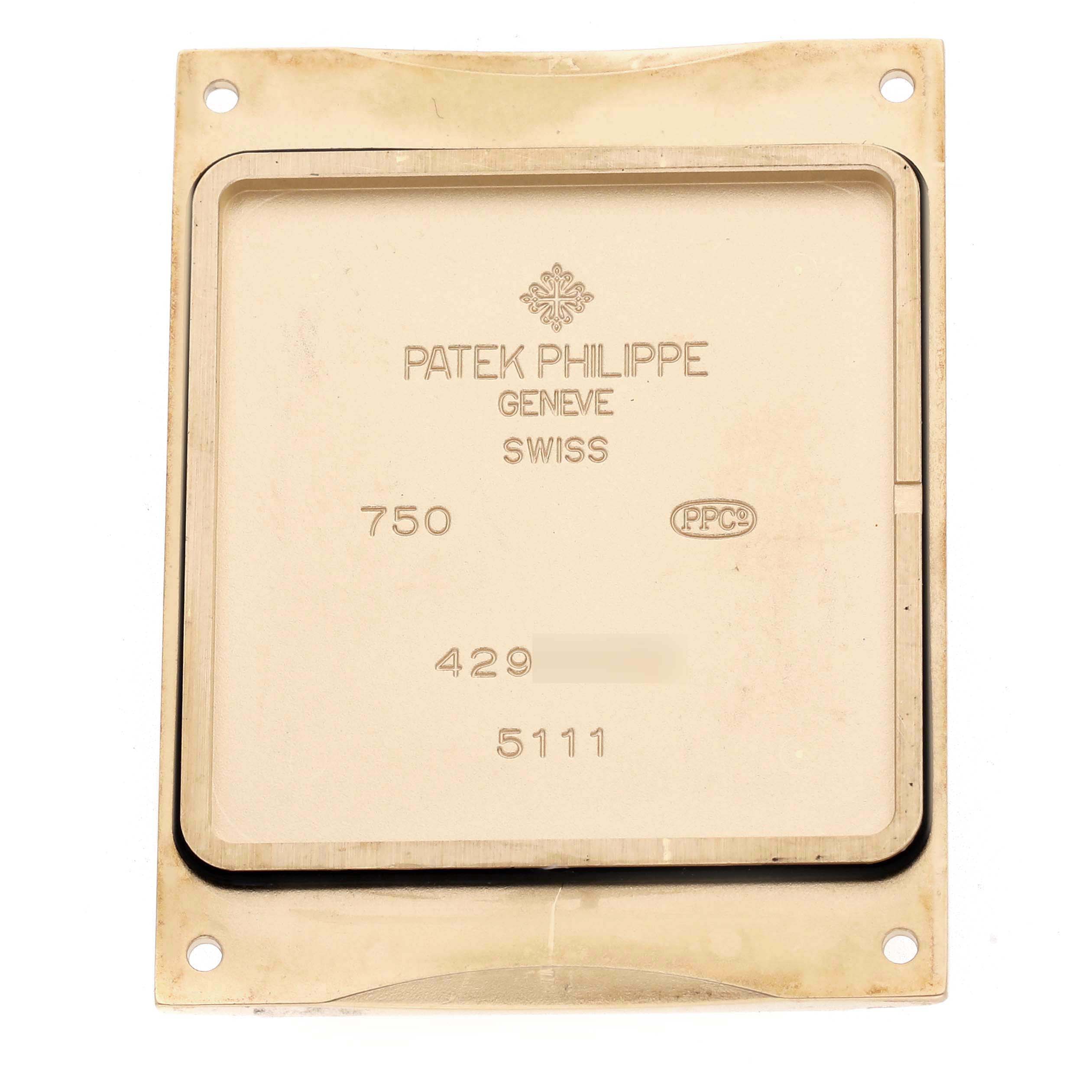 The image shows the case back of a Patek Philippe Gondolo model number 5111J, displaying the brand name, model number, and hallmarks.