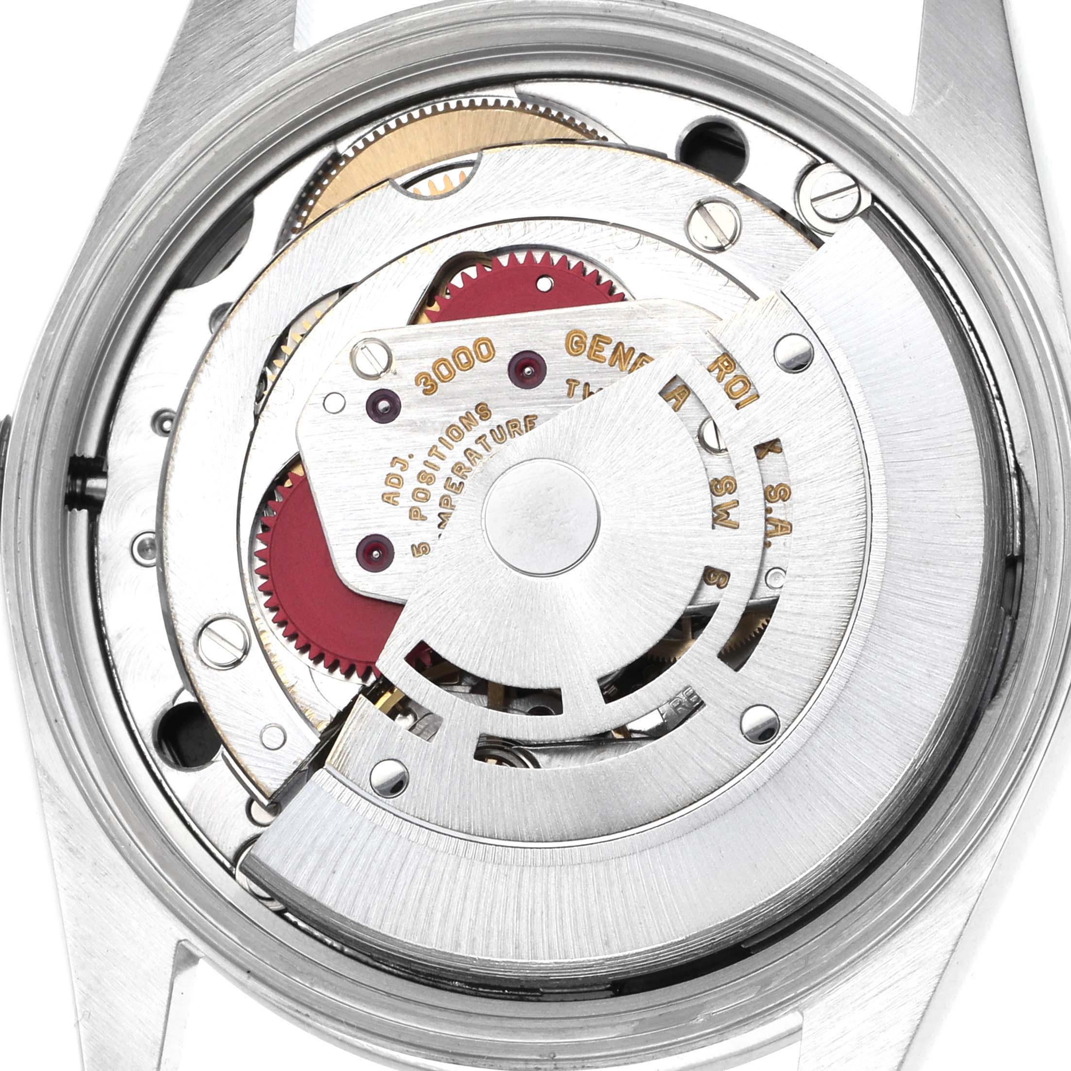 The image shows the movement of a Rolex Air-King model 14000, focusing on its internal mechanical components from a rear angle.