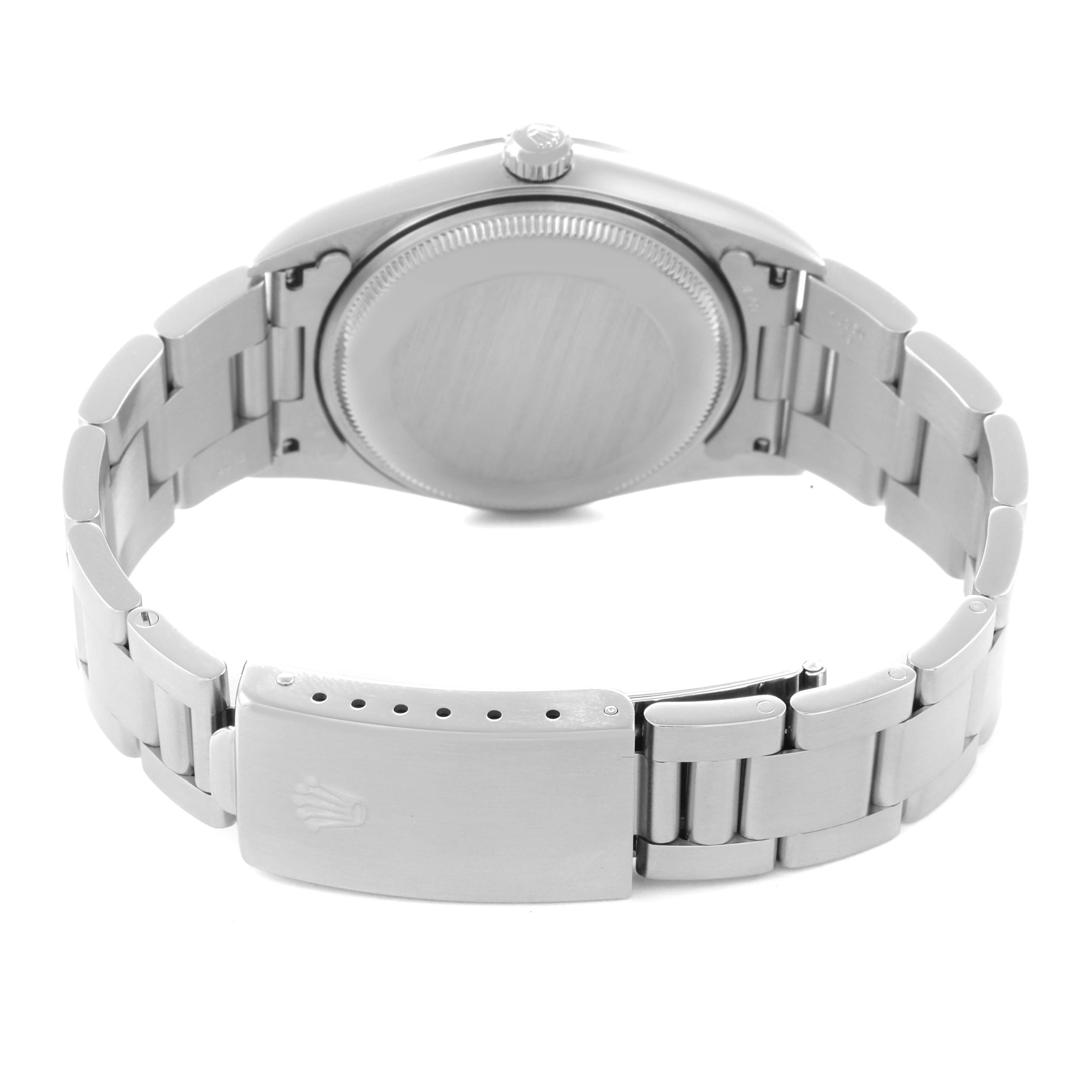 The image shows the Rolex Air-King model 14000 from the back, highlighting the case back, bracelet, and clasp.