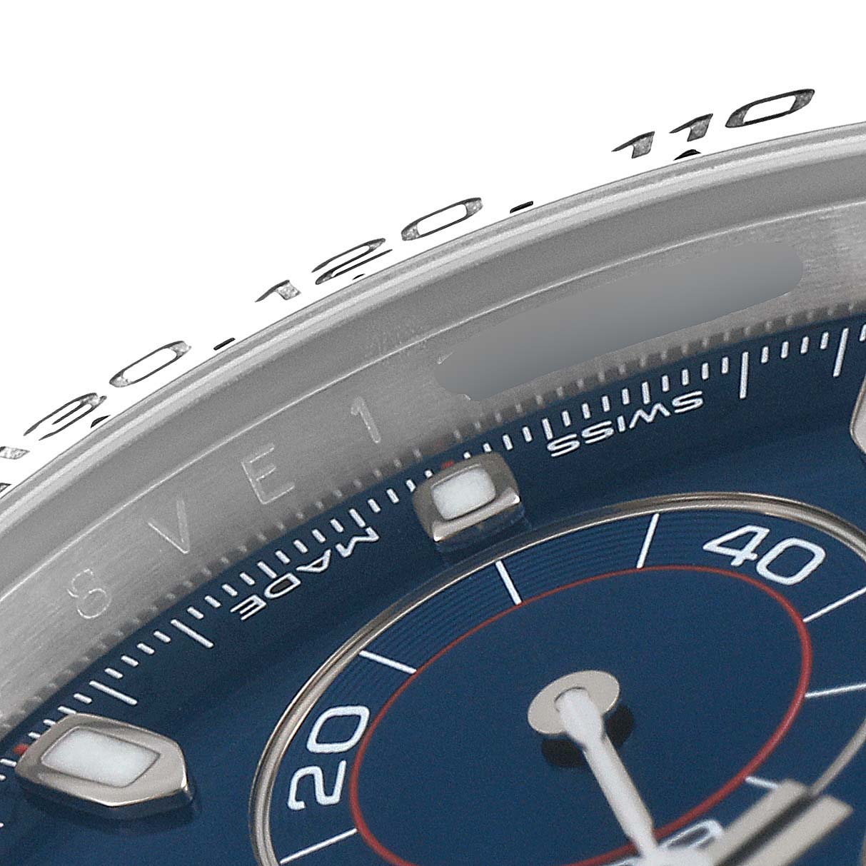 This close-up shows the dial, bezel, and part of the sub-dial of a Rolex Daytona 116509 Men's White Gold Blue Dial 116509 Men's White Gold Blue Dial watch.