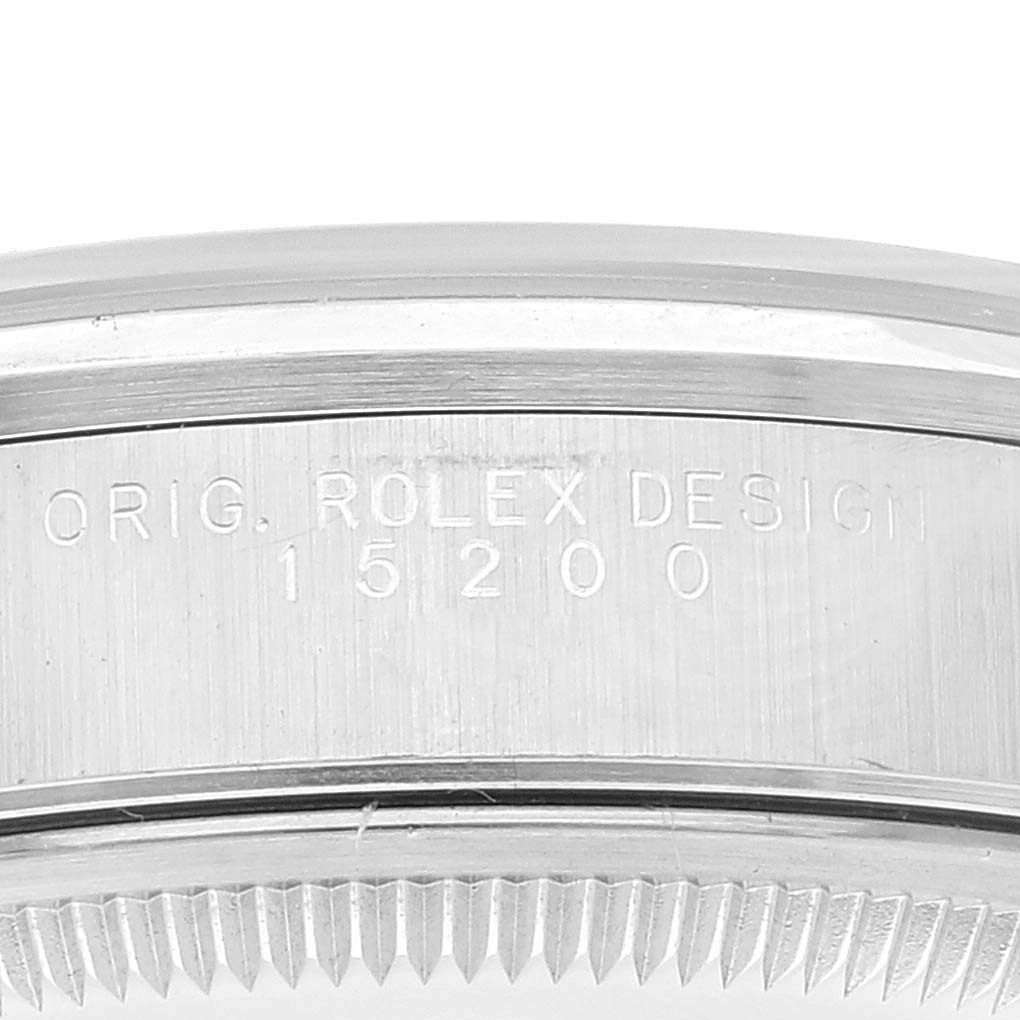 The image shows the serial number and design markings on the side of the Rolex Date 15200 Men's Stainless Steel Black Dial 15200 Men's Stainless Steel Black Dial model watch case.