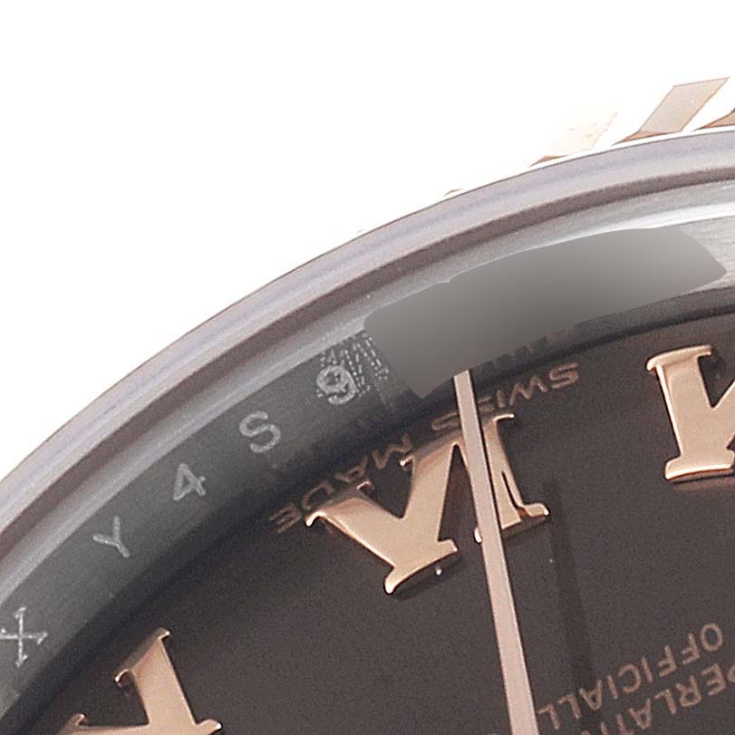 The image shows a close-up angle of the dial's edge and bezel of a Rolex Datejust 279171 Women's Steel and Gold (two tone) Brown Dial 279171 Women's Steel and Gold (two tone) Brown Dial watch, highlighting the Roman numerals and part of the seconds hand.