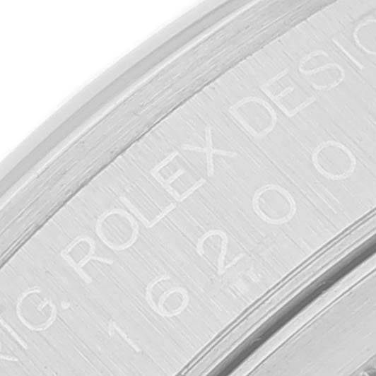 The image shows an engraving on the edge of the case back of a Rolex Datejust 16200 Men
s Stainless Steel Pink Dial 16200 Men
s Stainless Steel Pink Dial watch.