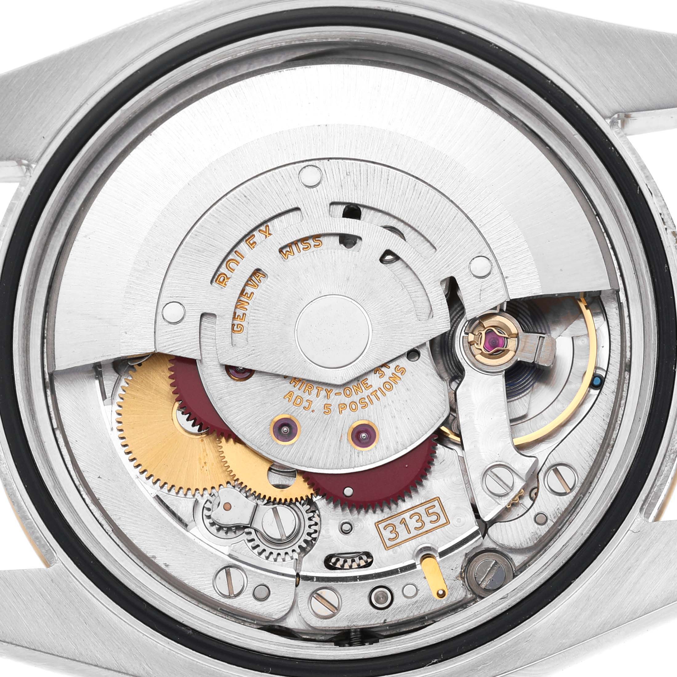 The image shows the internal movement of a Rolex Datejust 116203 Men's Steel and Gold (two tone) Champagne Dial, highlighting gears and the rotor from the back.