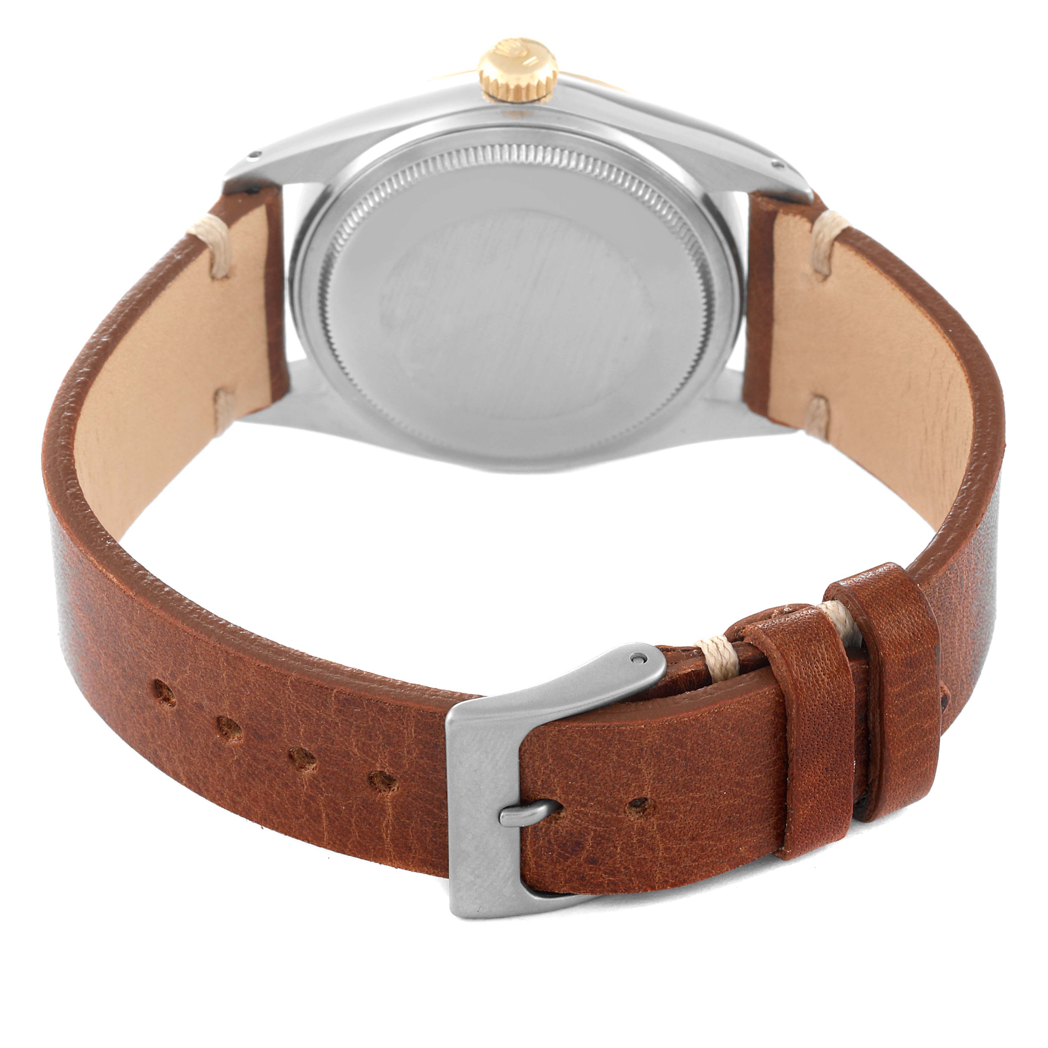 The image shows the back view of the Rolex Vintage Collection 16013 Men's Steel and Gold (two tone) Champagne Dial 16013 Men's Steel and Gold (two tone) Champagne Dial watch, highlighting its brown leather strap and buckle.