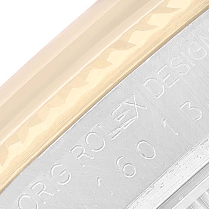 This image shows a close-up of the bezel and casing with engraved text of a Rolex Vintage Collection 16013 Men's Steel and Gold (two tone) Champagne Dial 16013 Men's Steel and Gold (two tone) Champagne Dial watch.