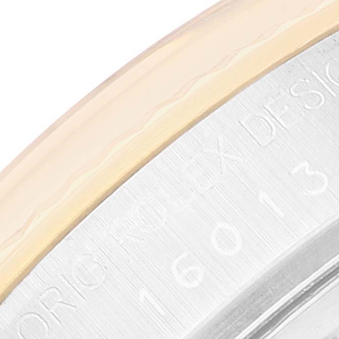 The image shows a close-up of the bezel and engraved caseback of the Vintage Collection model by Rolex.