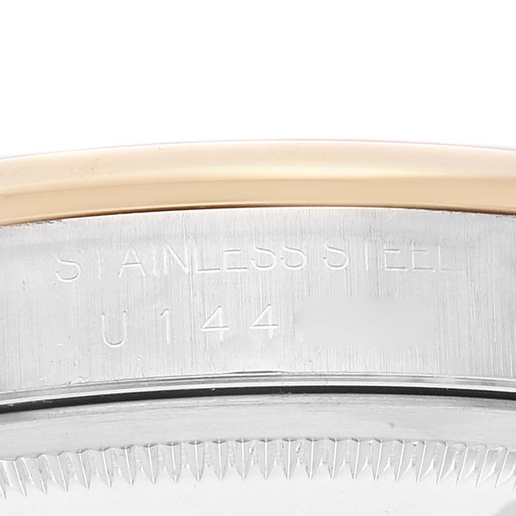 This image shows a close-up of the case back and bezel of a Rolex Datejust 16203 Men's Steel and Gold (two tone) Grey Dial 16203 Men's Steel and Gold (two tone) Grey Dial watch, highlighting the stainless steel engraving.