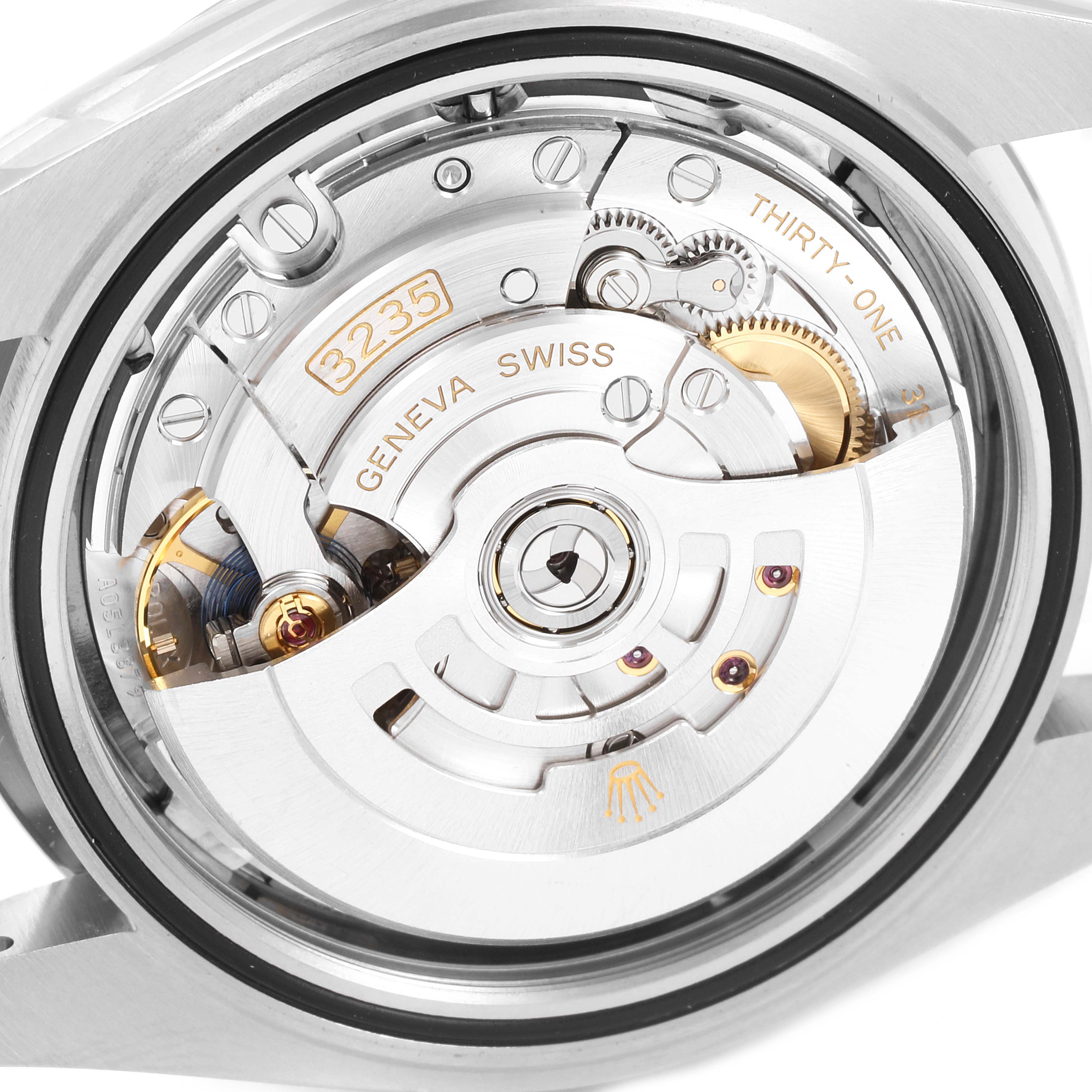 This close-up shows the movement's intricate mechanical components of the Rolex Datejust 41 126300 Men's Stainless Steel Grey Dial 126300 Men's Stainless Steel Grey Dial model.