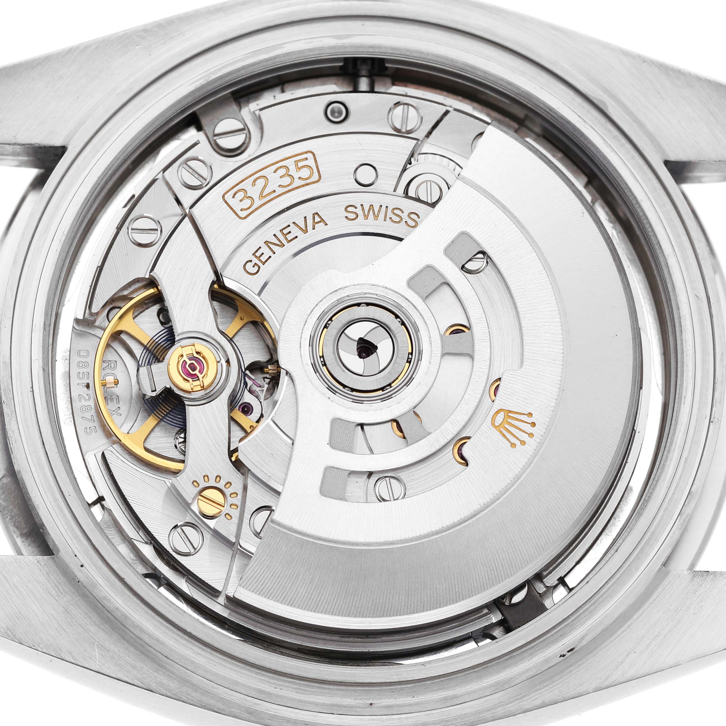 The image shows the back view of the Rolex Datejust 41 126300 Men's Stainless Steel Silver Dial, revealing its movement and intricate mechanisms.