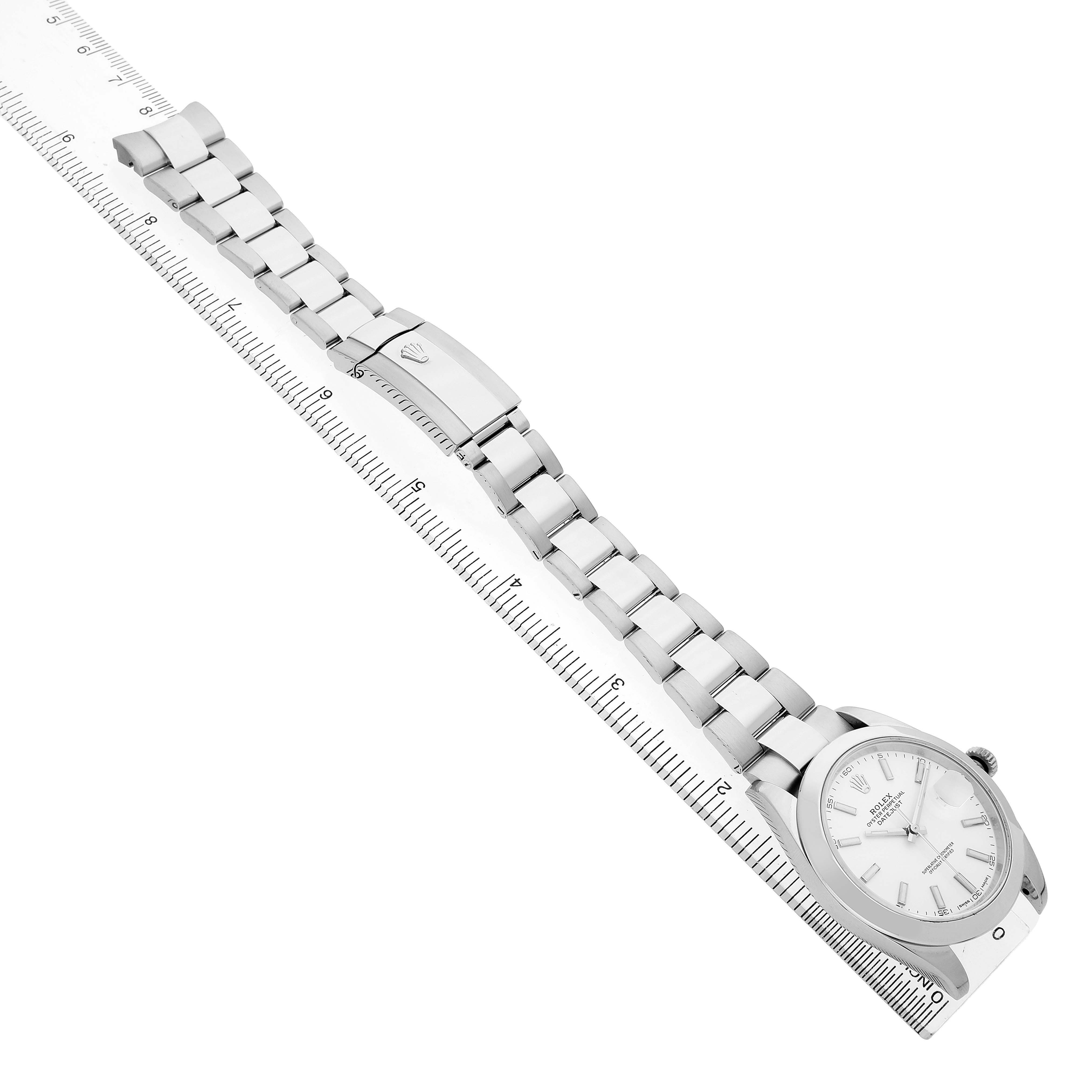 The Rolex Datejust 41 126300 Men's Stainless Steel White Dial is displayed diagonally, showing its bracelet, clasp, and dial alongside a ruler for scale.