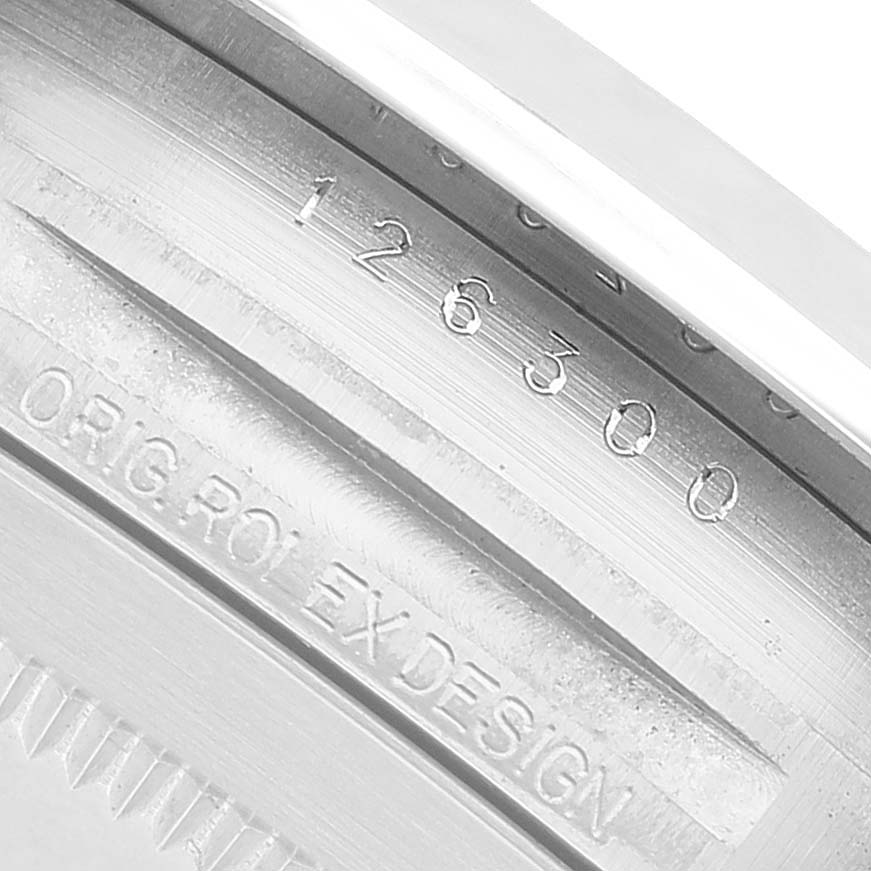 The image shows a close-up of the inner rim of a Rolex Datejust 41 126300 Men's Stainless Steel White Dial, highlighting the model number and "ORIG ROLEX DESIGN" engraving.