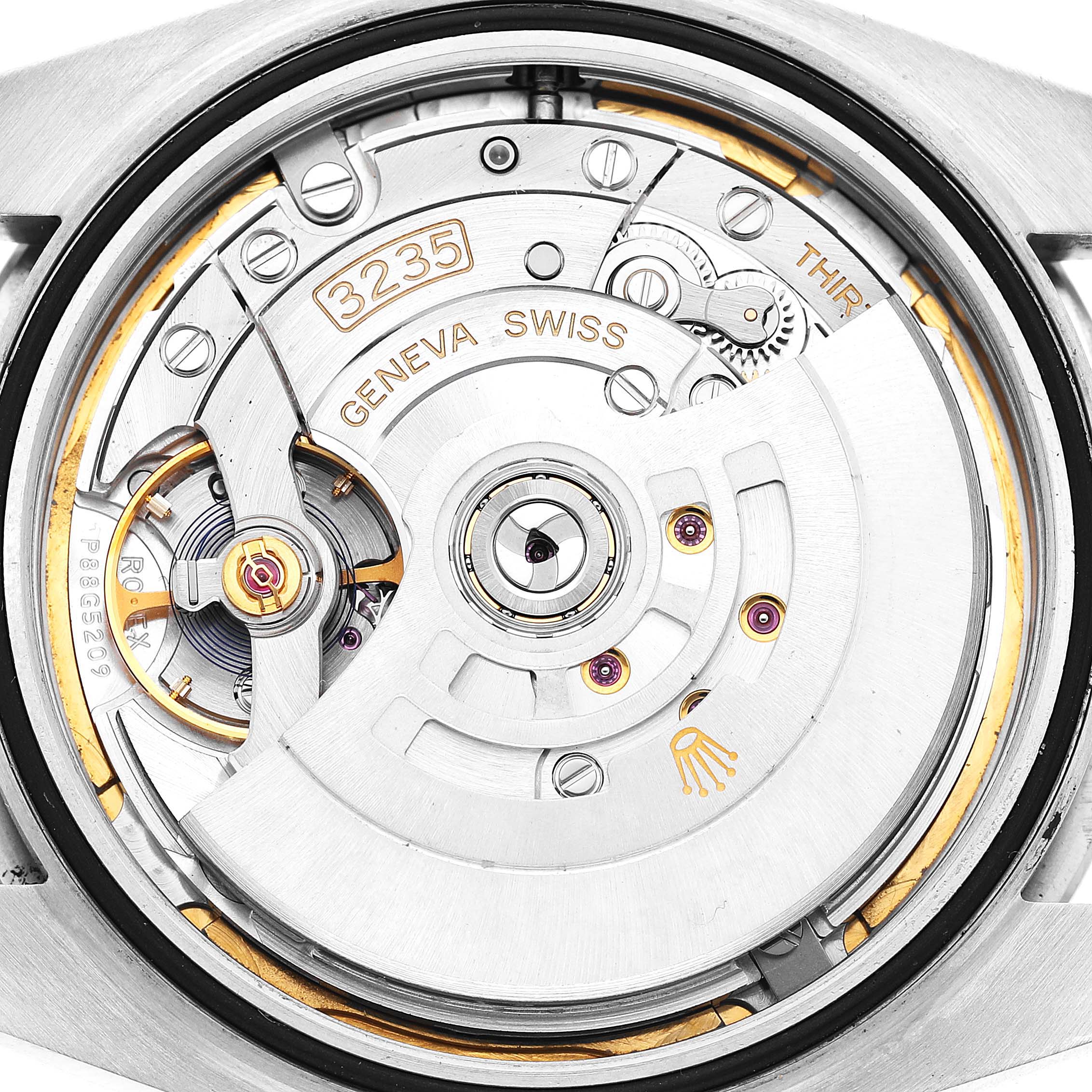 The image shows the back view of a Rolex Datejust 41 126300 Men's Stainless Steel White Dial, highlighting the intricate movement and rotor.