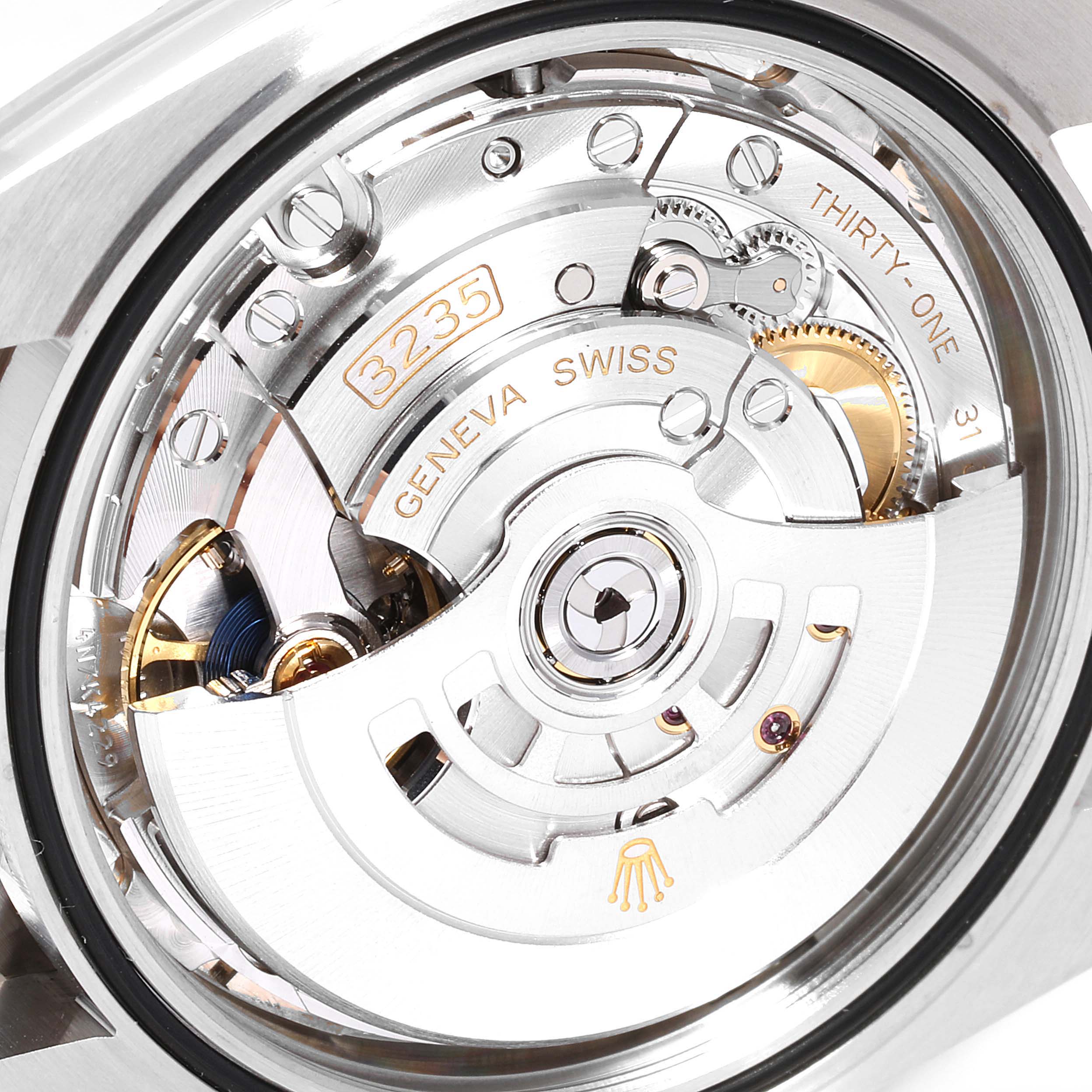 The image shows a close-up view of the movement inside the Rolex Datejust 41 126334 Men's Stainless Steel Silver Dial 126334 Men's Stainless Steel Silver Dial, highlighting the intricate mechanisms.