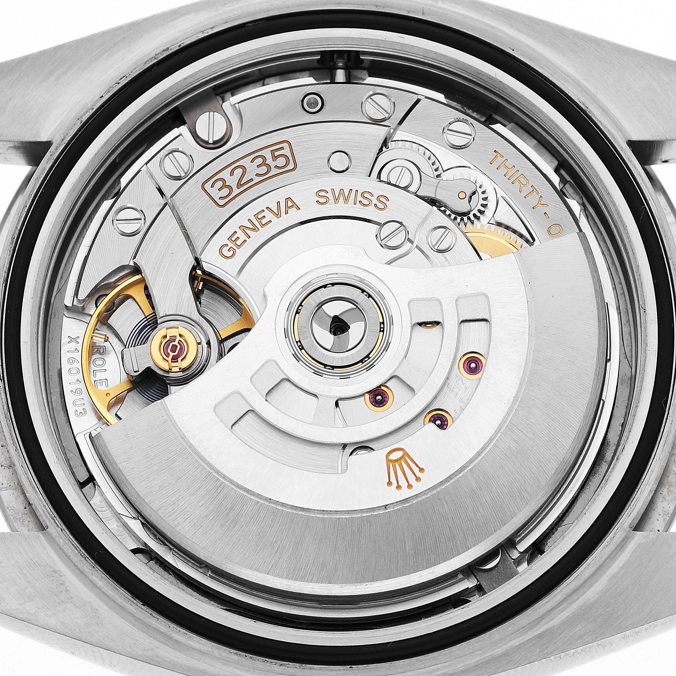The image shows a close-up of the movement of a Rolex Datejust 41 126334 Men's Stainless Steel Grey Dial, highlighting the rotor and intricate mechanisms.