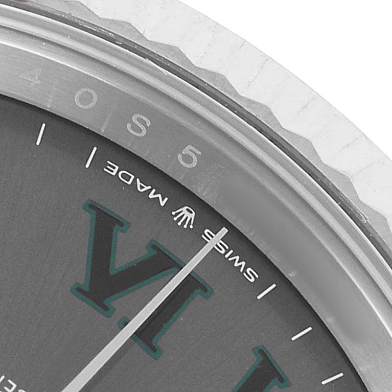 The image shows a close-up of the dial edge and fluted bezel of a Rolex Datejust 41 126334 Men's Stainless Steel Grey Dial, highlighting the "Swiss Made" text.