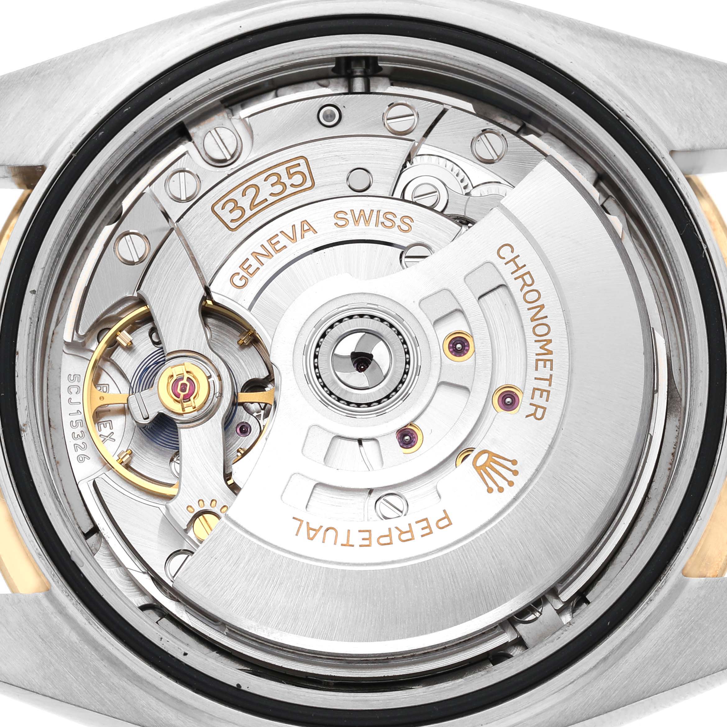 The image shows the movement of a Rolex Datejust 41 126333 Men's Steel and Gold (two tone) Grey Dial, highlighting the rotor, balance wheel, and engravings.