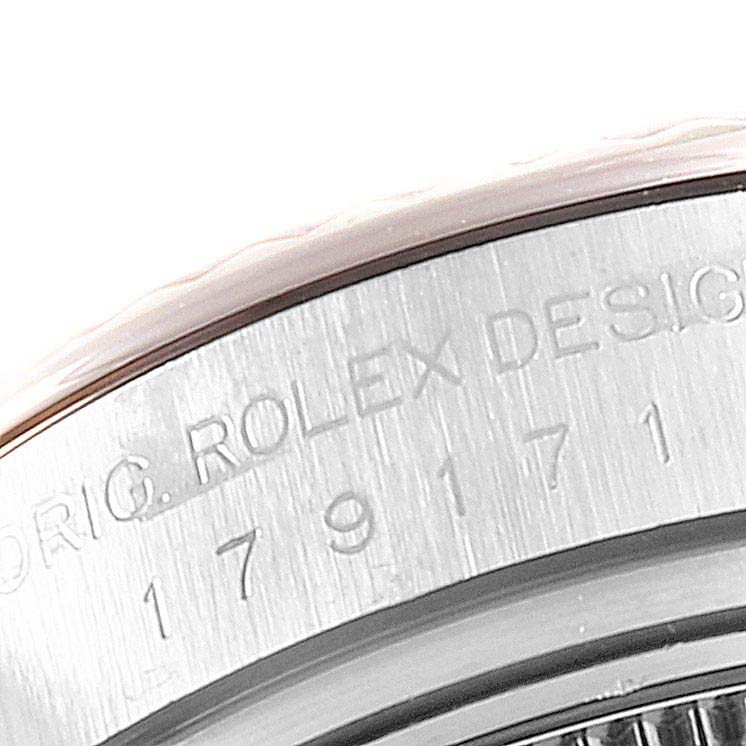 This image shows a close-up of the engraved bezel on the Rolex Datejust 179171 Women's Steel and Gold (two tone) Mother of Pearl Dial 179171 Women's Steel and Gold (two tone) Mother of Pearl Dial watch.