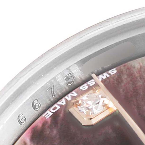 The image shows a close-up of the dial of a Rolex Datejust 179171 Women's Steel and Gold (two tone) Mother of Pearl Dial 179171 Women's Steel and Gold (two tone) Mother of Pearl Dial watch, highlighting a diamond marker and "Swiss Made" inscription.