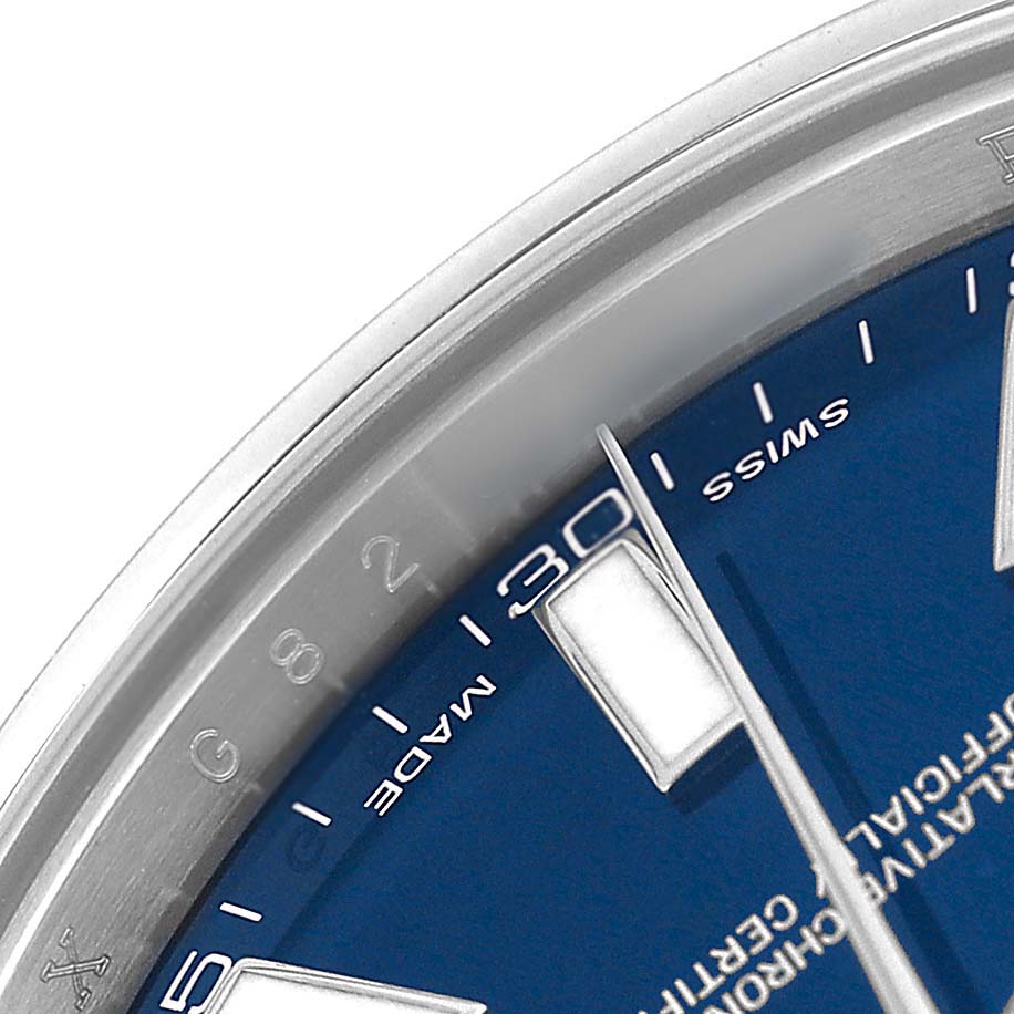 This close-up of the Rolex Datejust 41 116300 Men's Stainless Steel Blue Dial watch shows part of the blue dial, silver hands, and the edge of the bezel.