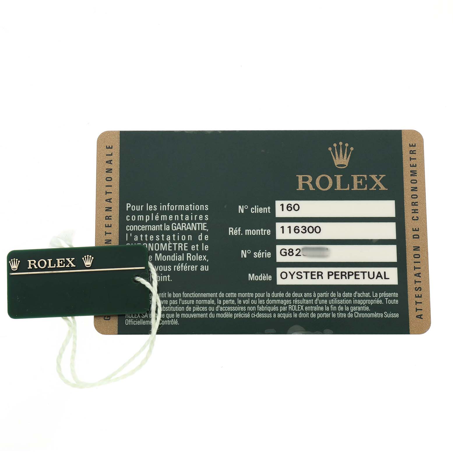 The image shows a Rolex Datejust 41 116300 Men's Stainless Steel Blue Dial warranty card and a green Rolex tag with a string.
