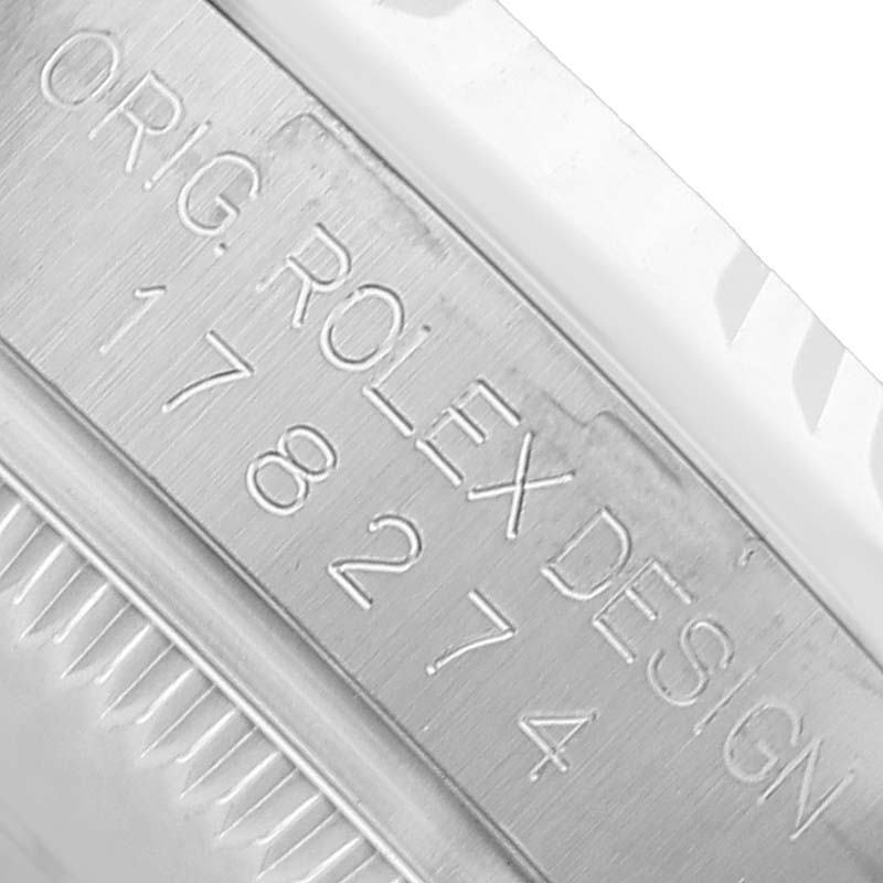 The image shows the side of a Rolex Mid-Size 178274 Women's Stainless Steel Blue Dial model, focusing on the engraved model number and "ORIG. ROLEX DESIGN."