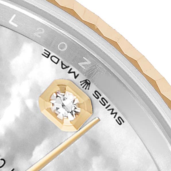 The image shows a close-up of a Rolex Mid-Size 82598 Women's Steel and Gold (two tone) Mother of Pearl Dial watch face, highlighting a diamond marker and part of the watch bezel.