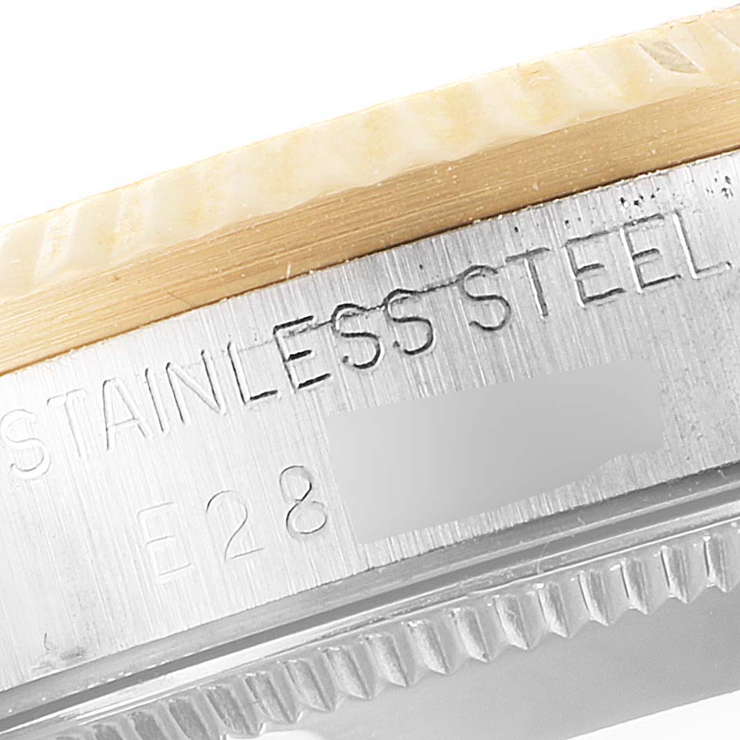 This is a close-up angle showing the side engraving of the Rolex Mid-Size 68273 Women's Steel and Gold (two tone) Champagne Dial 68273 Women's Steel and Gold (two tone) Champagne Dial stainless steel watch.