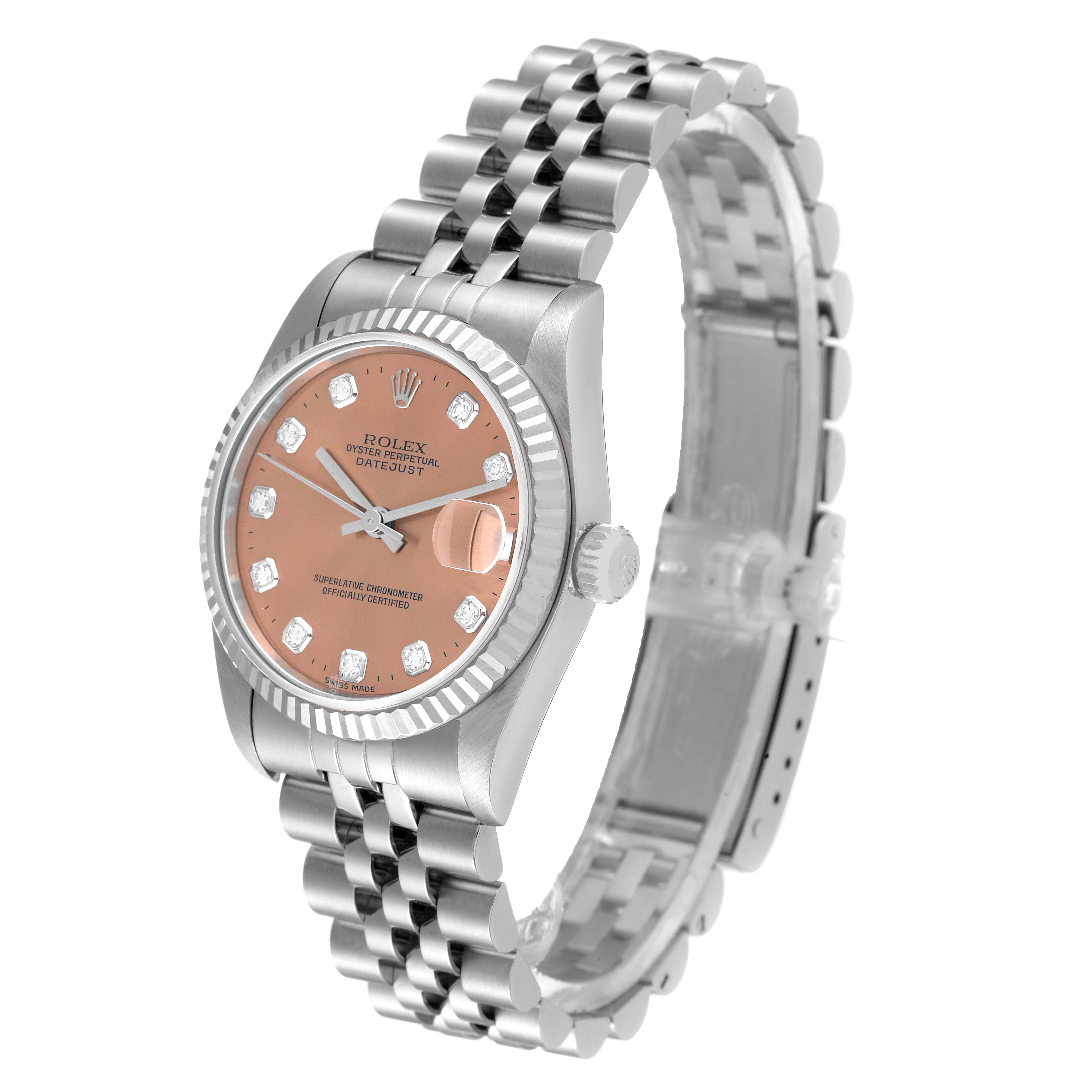 The Rolex Mid-Size 68274 Women
s Stainless Steel Pink Dial 68274 Women
s Stainless Steel Pink Dial model watch is shown at an angled side view, highlighting its clasp, band, dial, crown, and bezel.