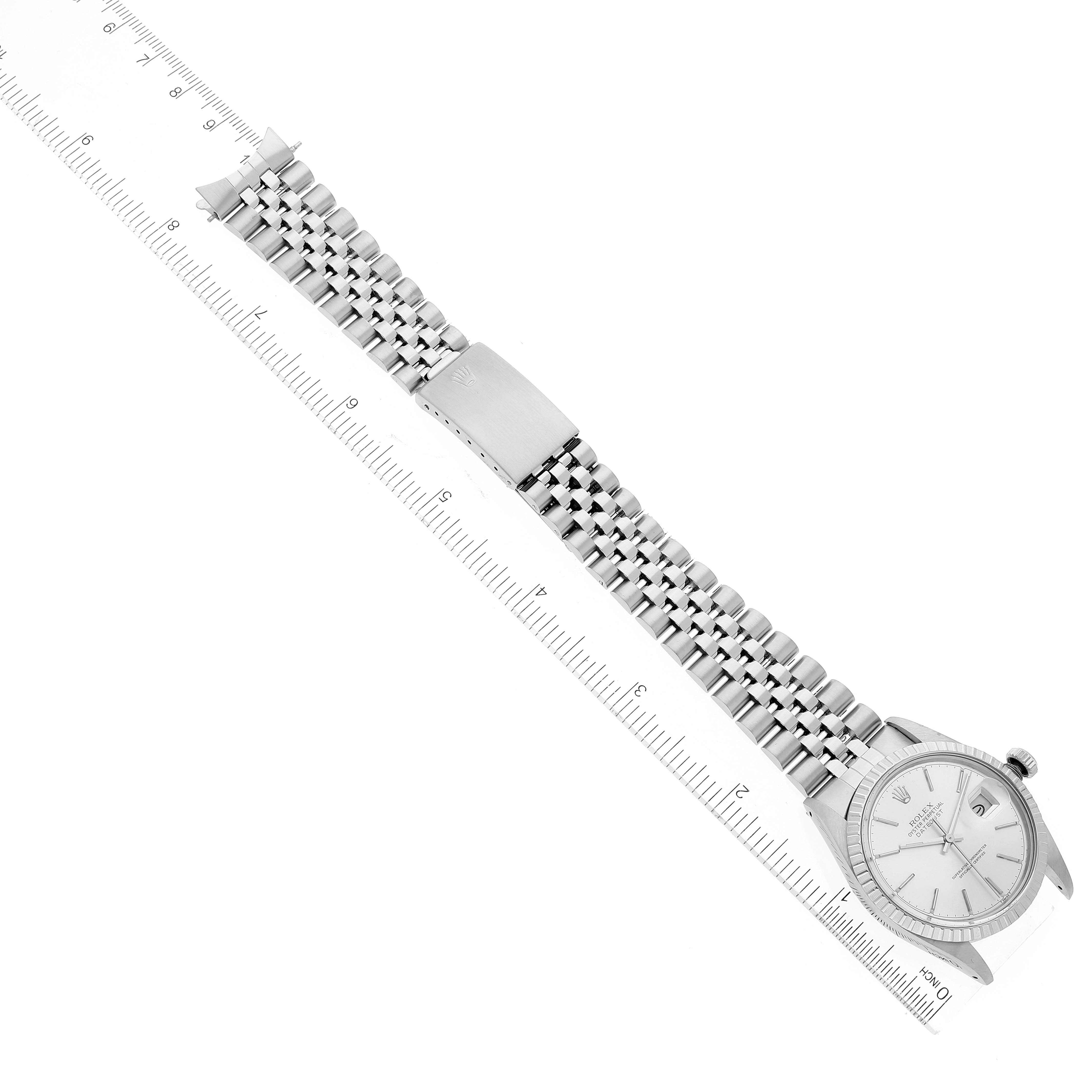 The image shows the Rolex Vintage Collection 16030 Men's Stainless Steel Silver Dial 16030 Men's Stainless Steel Silver Dial watch laid flat with its face, band, and clasp visible beside a ruler.