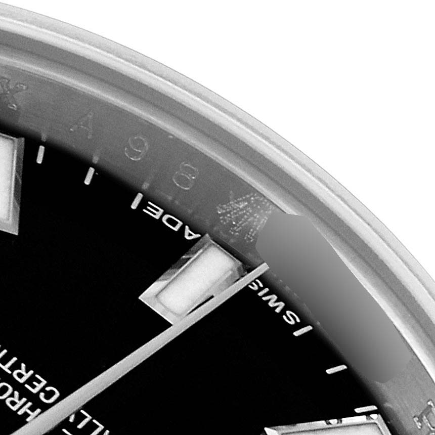 This image shows a close-up of the dial and part of the rehaut of a Rolex Datejust 179174 Women's Stainless Steel Black Dial 179174 Women's Stainless Steel Black Dial watch at an oblique angle.