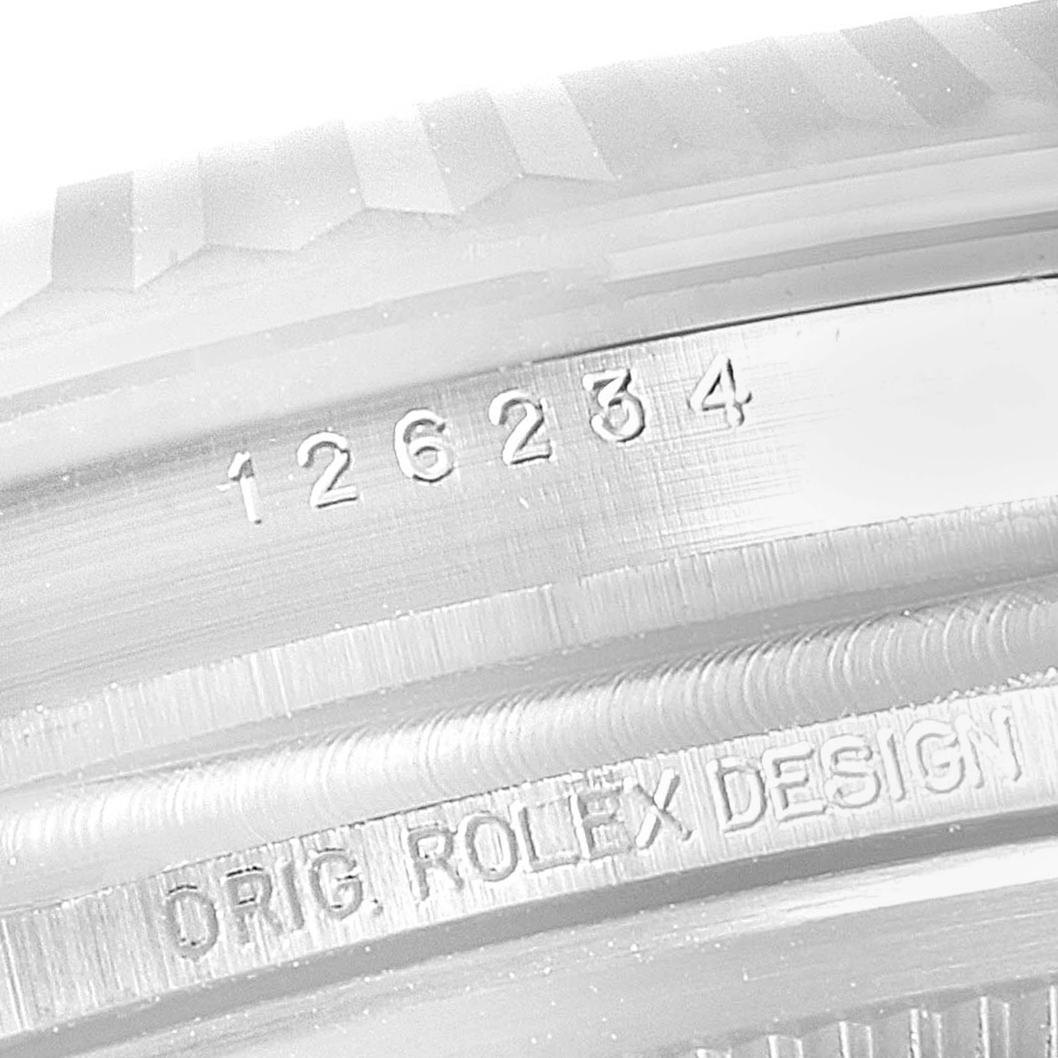 This close-up image shows the engraved serial numbers on the side profile of the Rolex Datejust 126234 Men
s Stainless Steel Black Dial 126234 Men
s Stainless Steel Black Dial model watch case.
