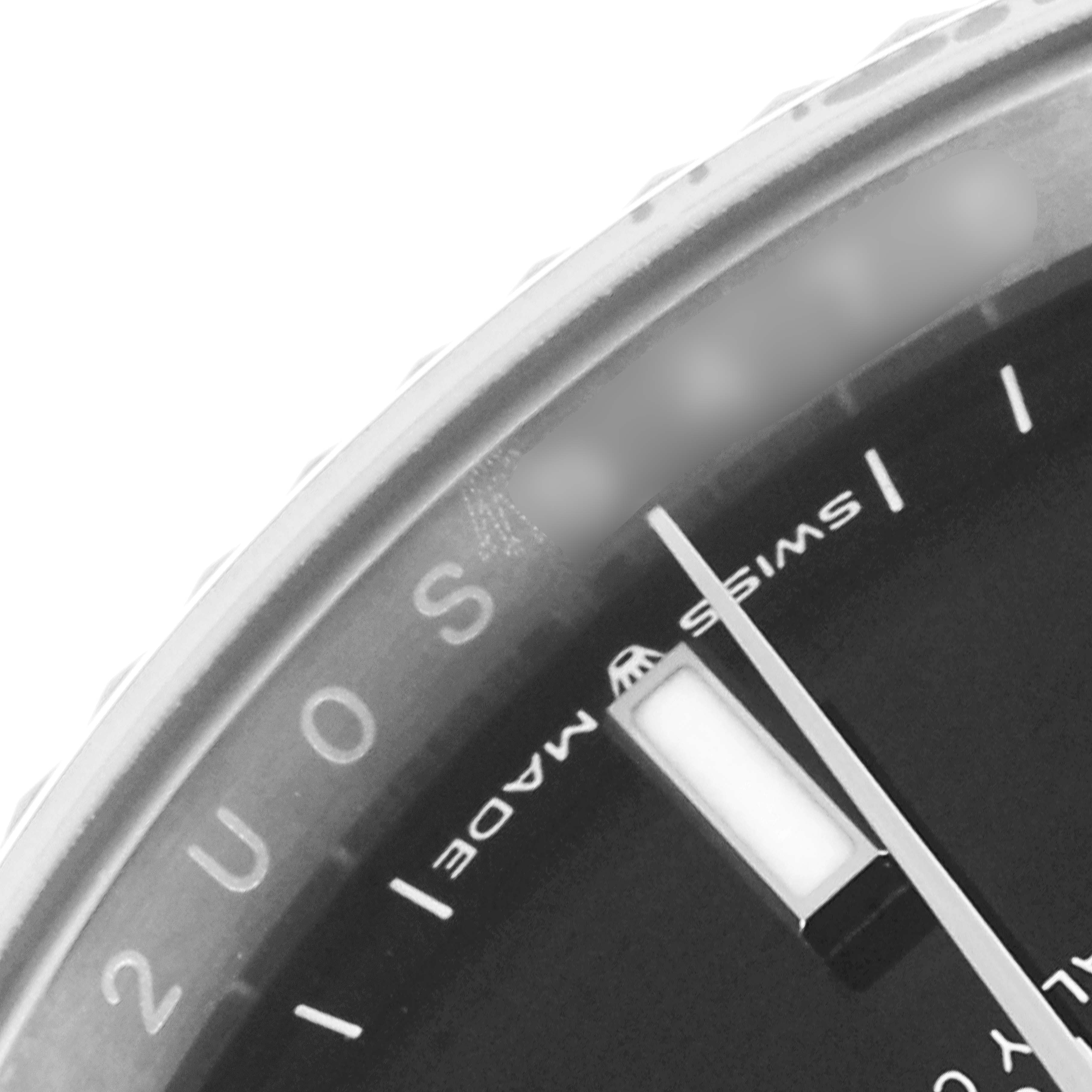 This close-up image shows a portion of the bezel, dial, and indices of a Rolex Datejust 126234 Men
s Stainless Steel Black Dial 126234 Men
s Stainless Steel Black Dial watch.