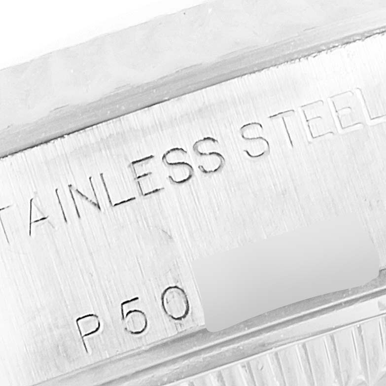 This image shows a close-up of the stainless steel case, with the serial number of a Rolex Datejust 79174 Women
s Stainless Steel Silver Dial 79174 Women
s Stainless Steel Silver Dial watch.
