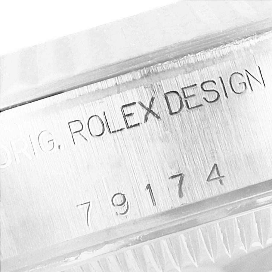 This image shows a close-up of the casing with engraved text on the Rolex Datejust 79174 Women
s Stainless Steel Silver Dial 79174 Women
s Stainless Steel Silver Dial watch.